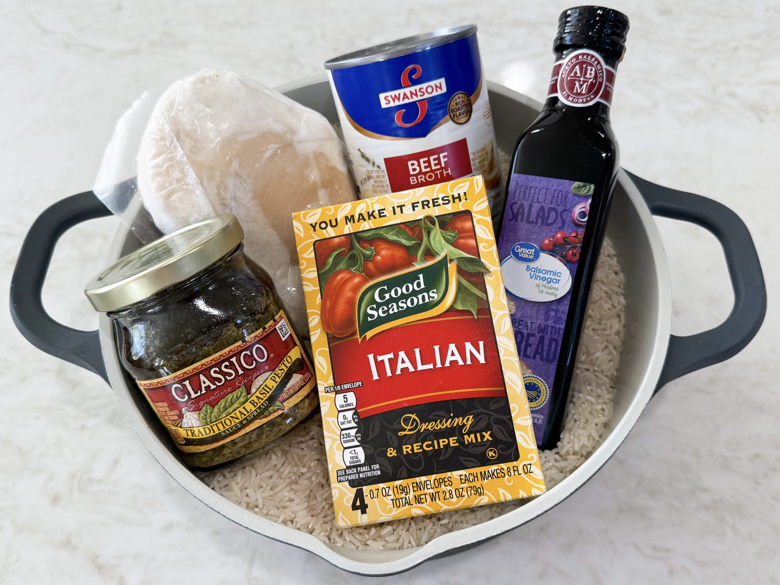 Caprese Chicken and Rice whole ingredients sitting in a pot.