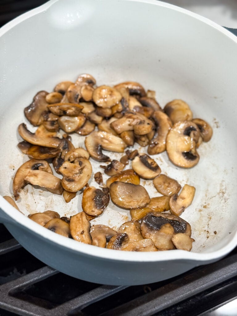 sliced mushrooms sauteed in a large skillet