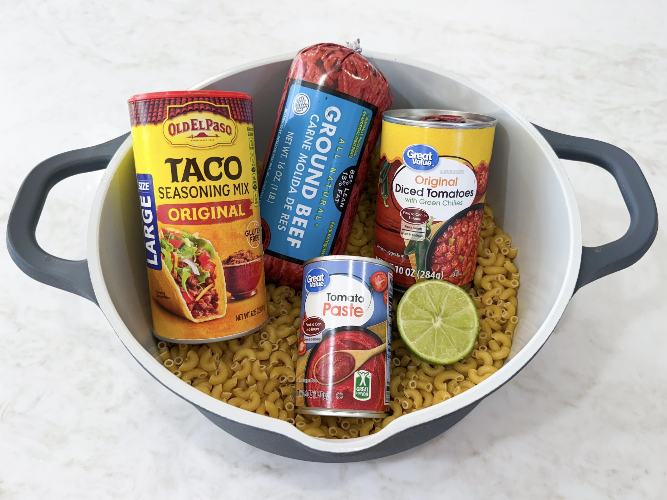 Easy Taco Pasta One Pot Skillet Dinner ingredients in a pot on the counter.