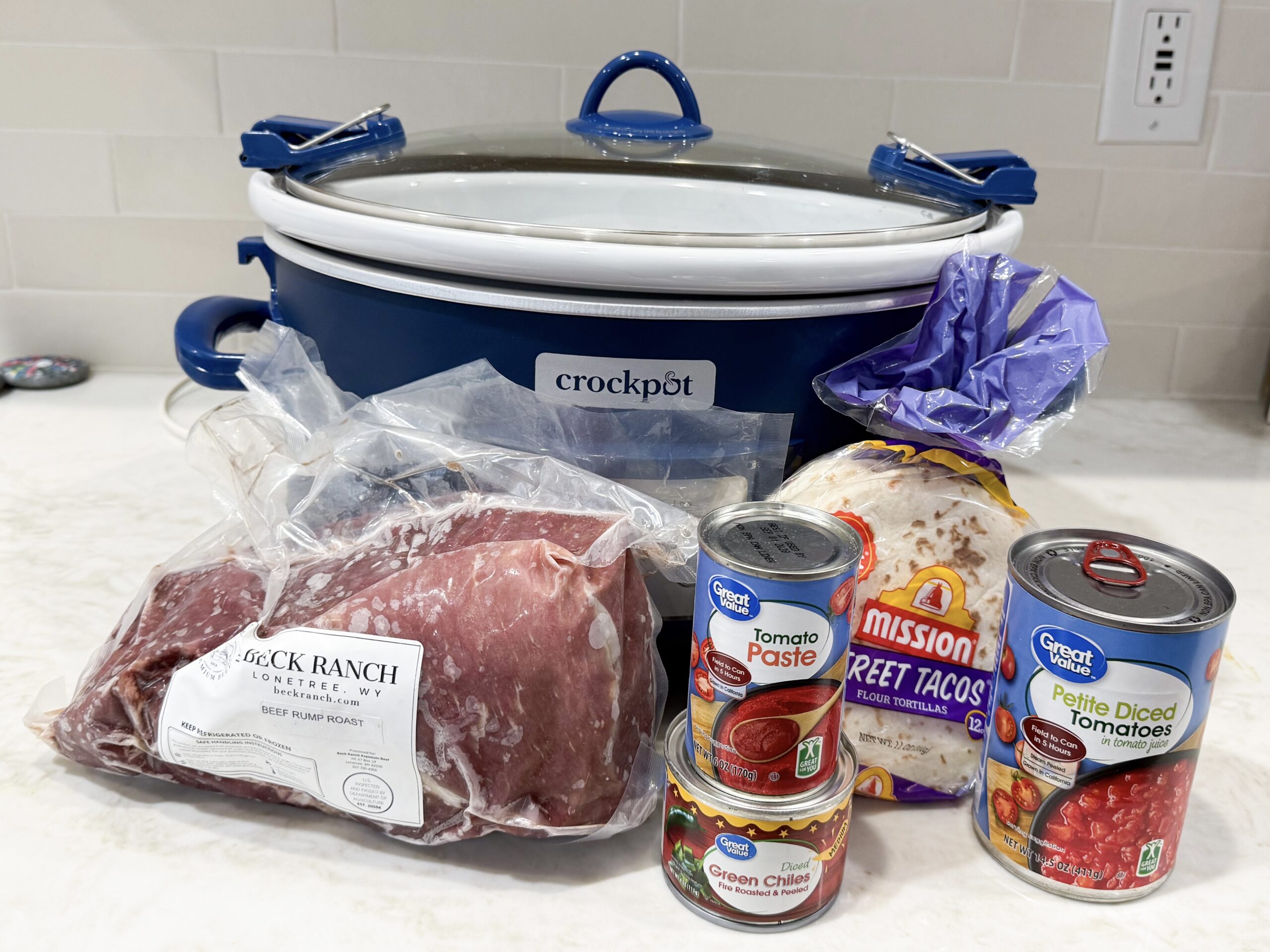 ingredients for crockpot carne asada on countertop