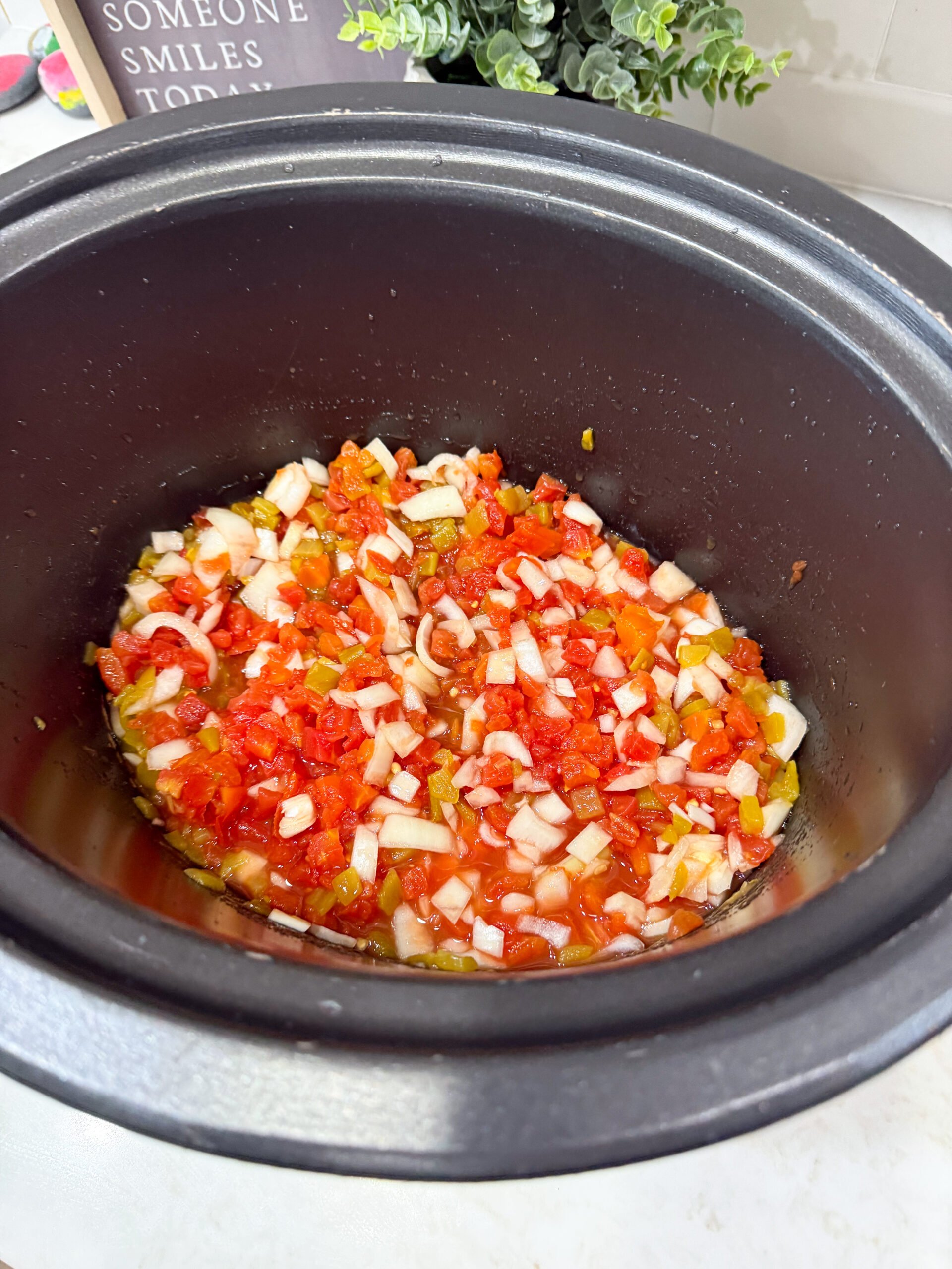 tomatoes and green chiles added to slow cooker