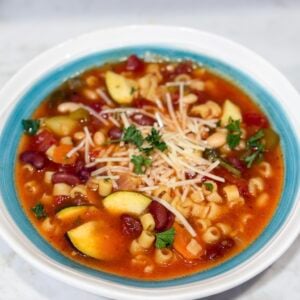 Slow cooker minestrone soup in bowl with Parmesan