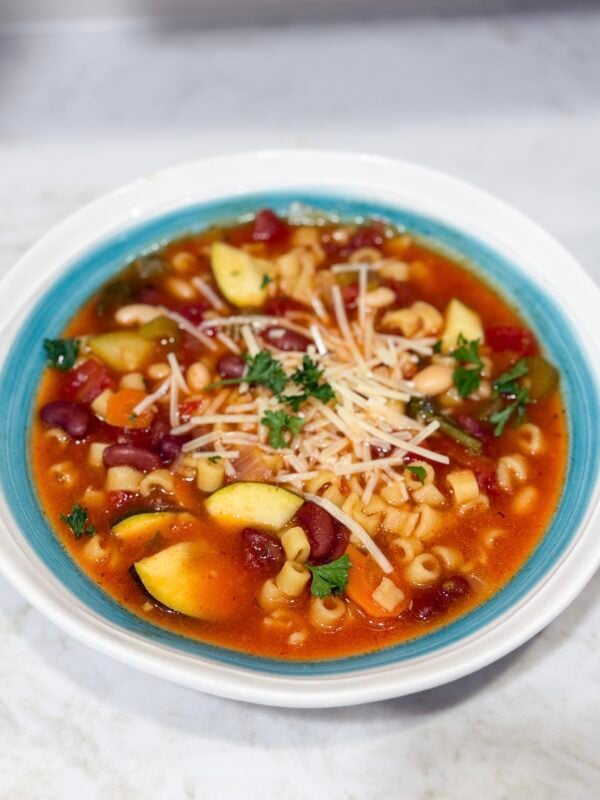 Slow cooker minestrone soup in bowl with Parmesan