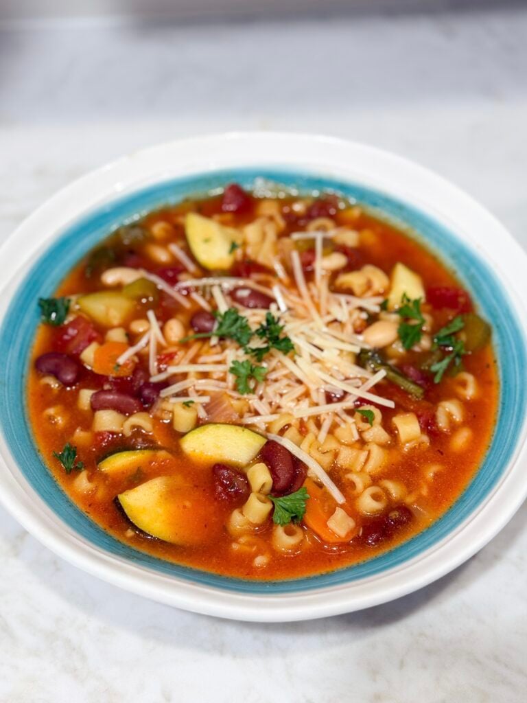 Bowl of minestrone soup with vegetables and pasta
