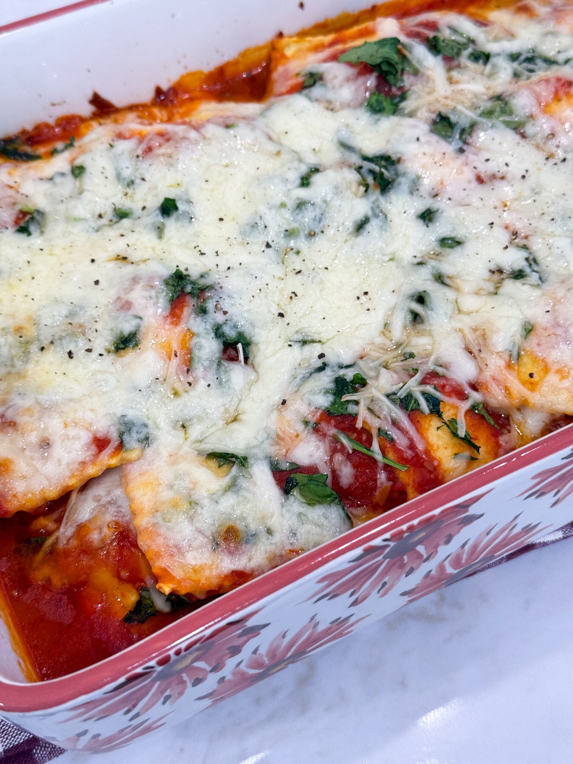 Baked ravioli casserole with melted cheese