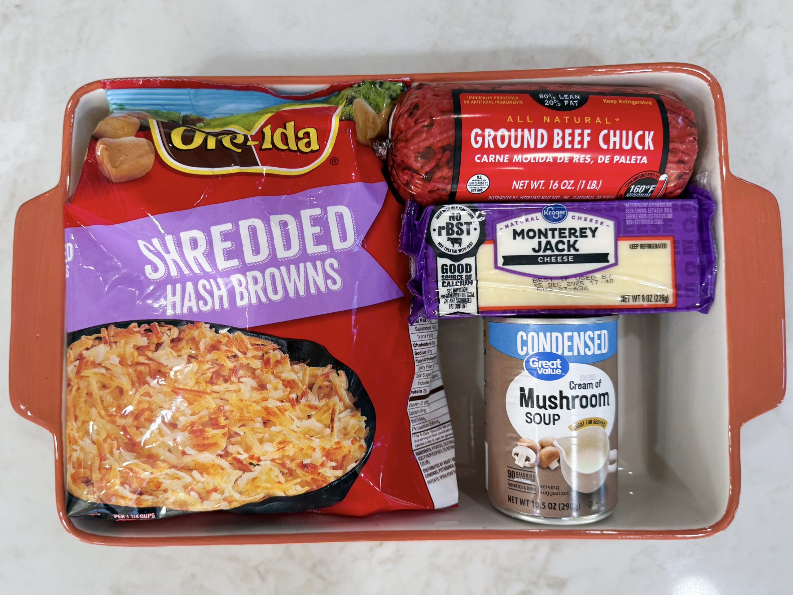 Ingredients for hashbrown hamburger casserole on counter