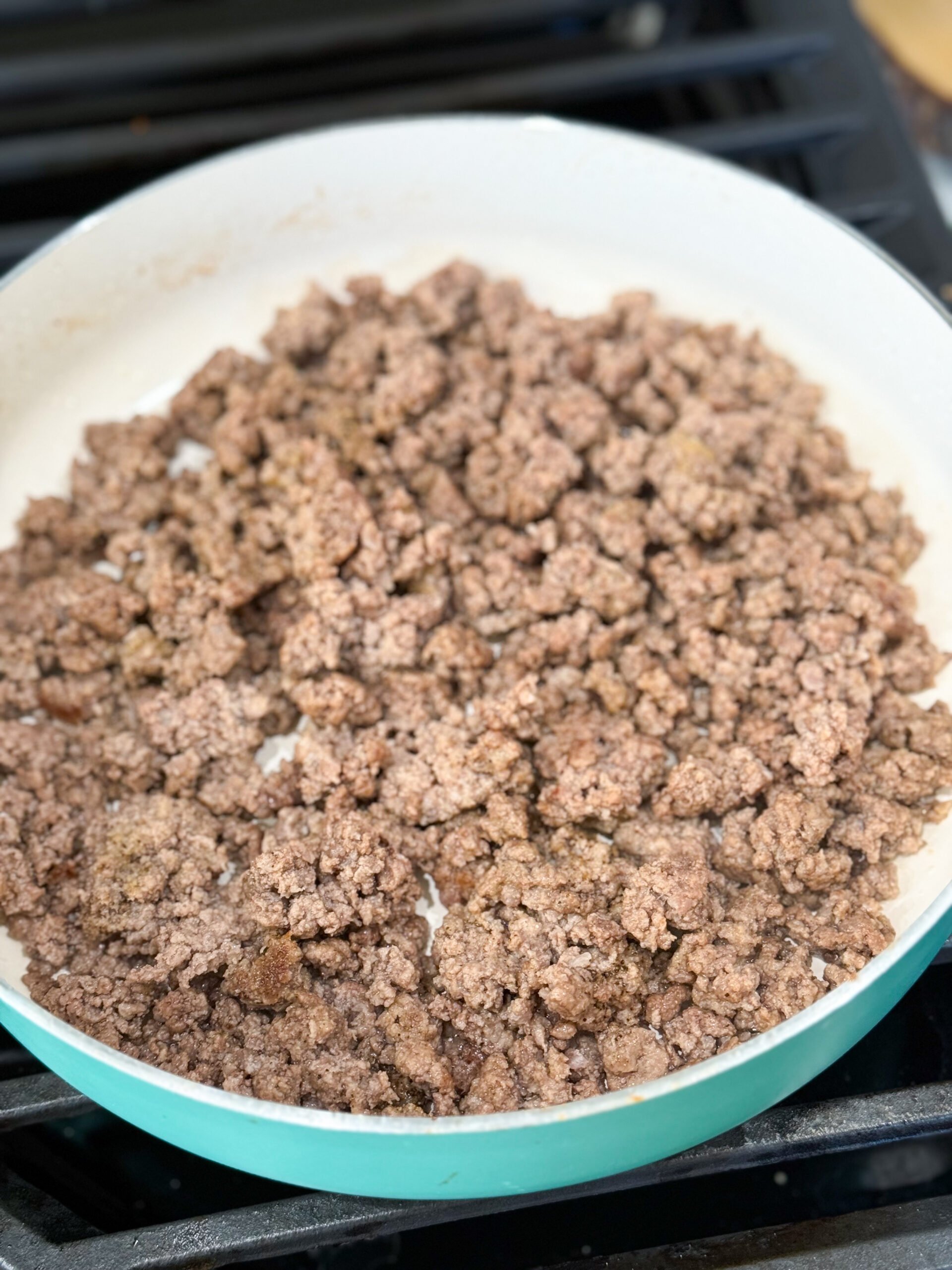 Ground beef cooking in skillet