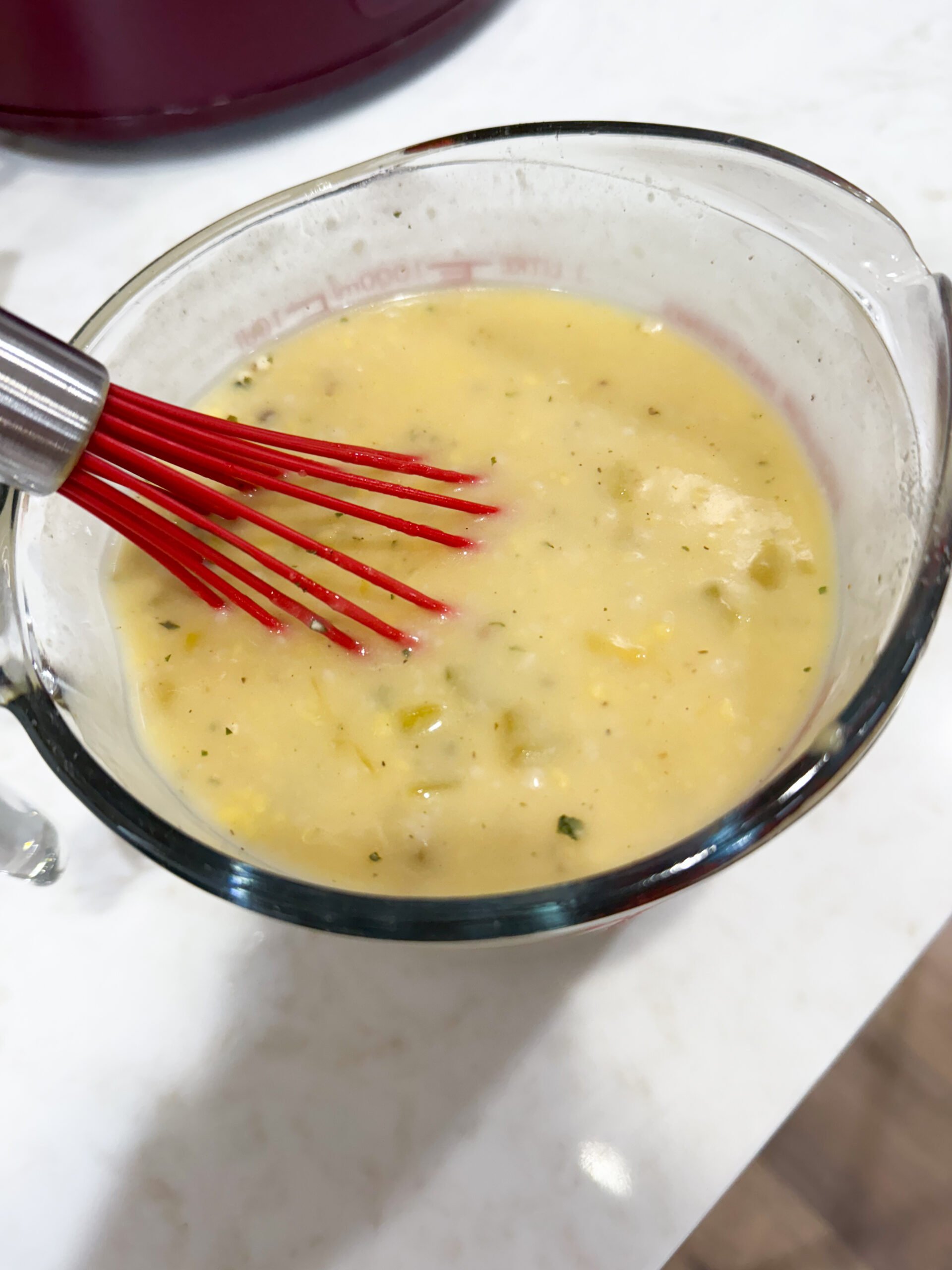 creamy ranch sauce whisked in a bowl