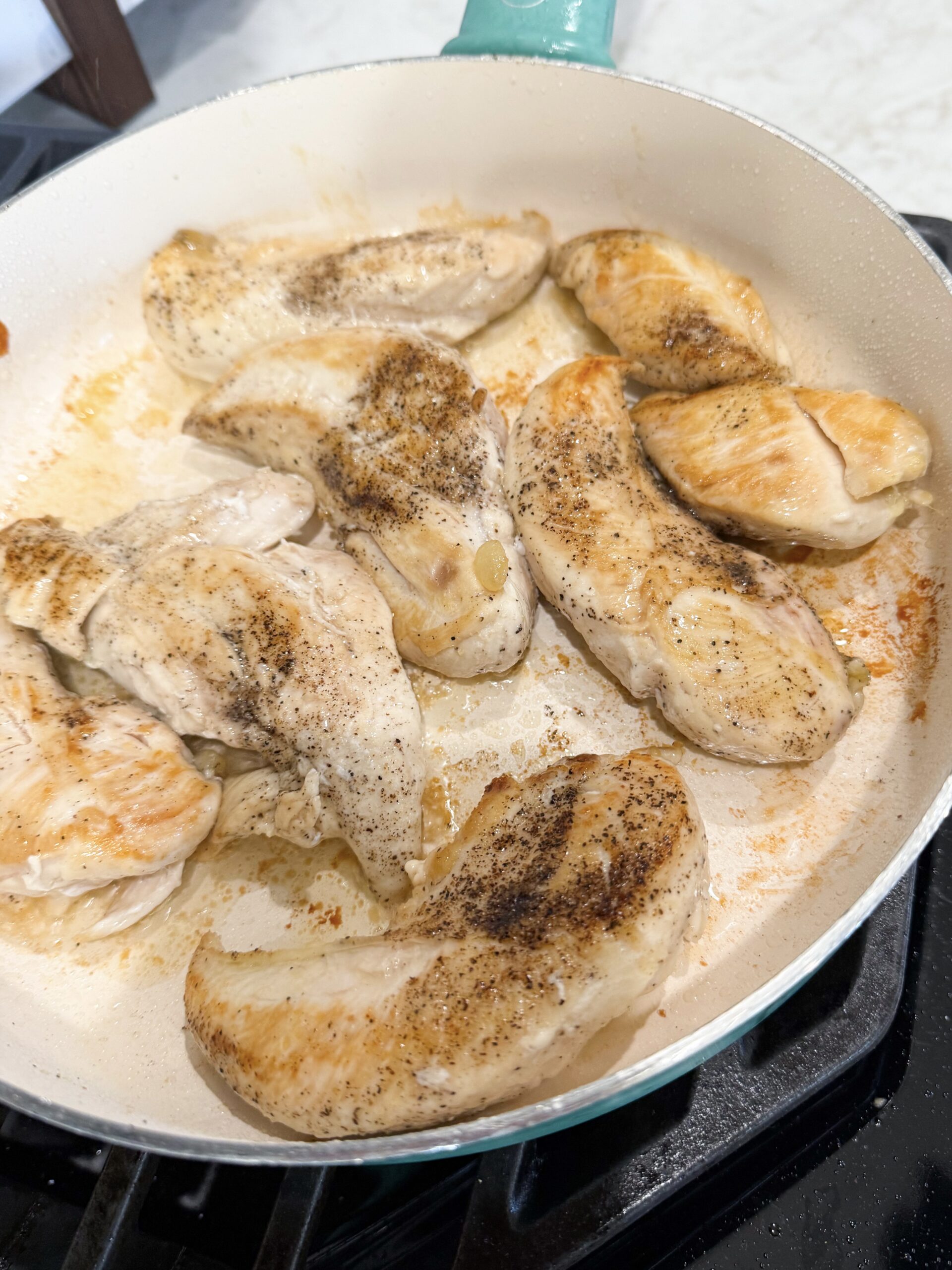 chicken cooking in skillet