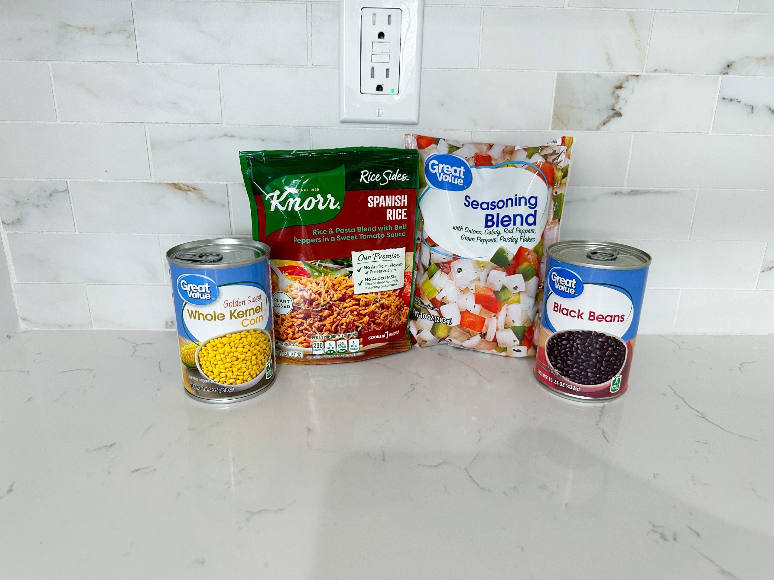 Ingredients for Spanish Rice Soup including rice mix, beans, and corn