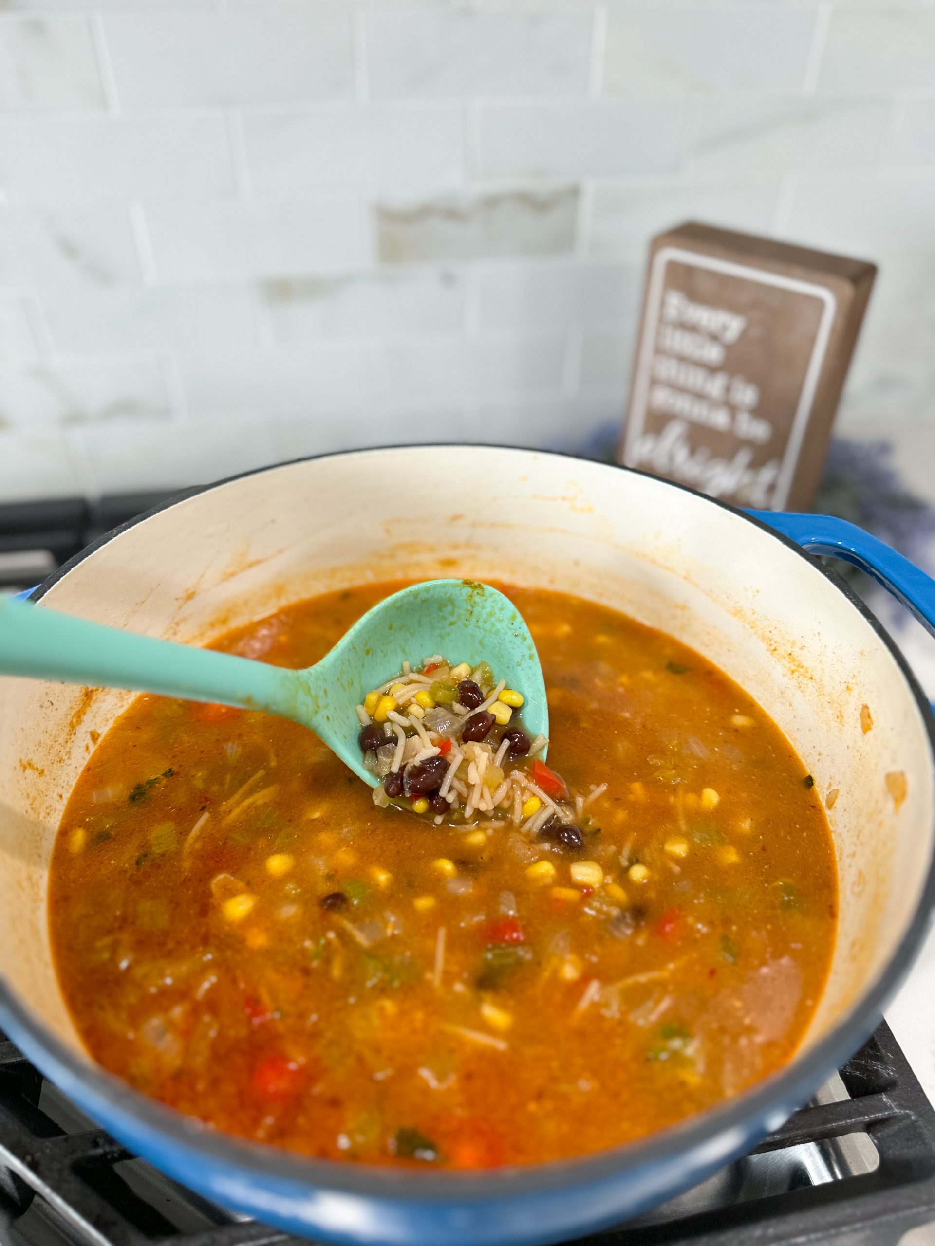Spanish Rice Soup simmering with beans and corn