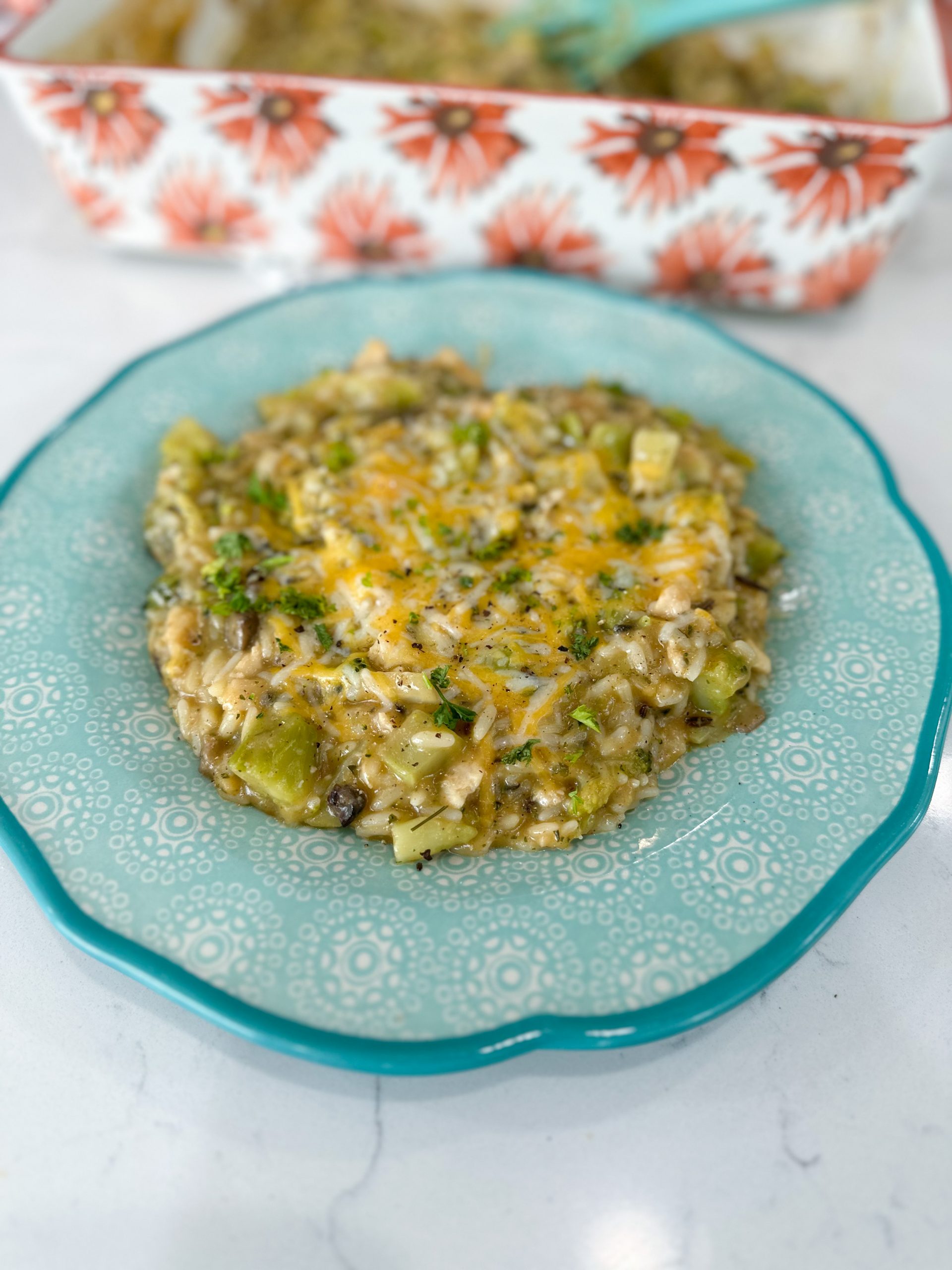 Creamy chicken and rice casserole with broccoli in a baking dish