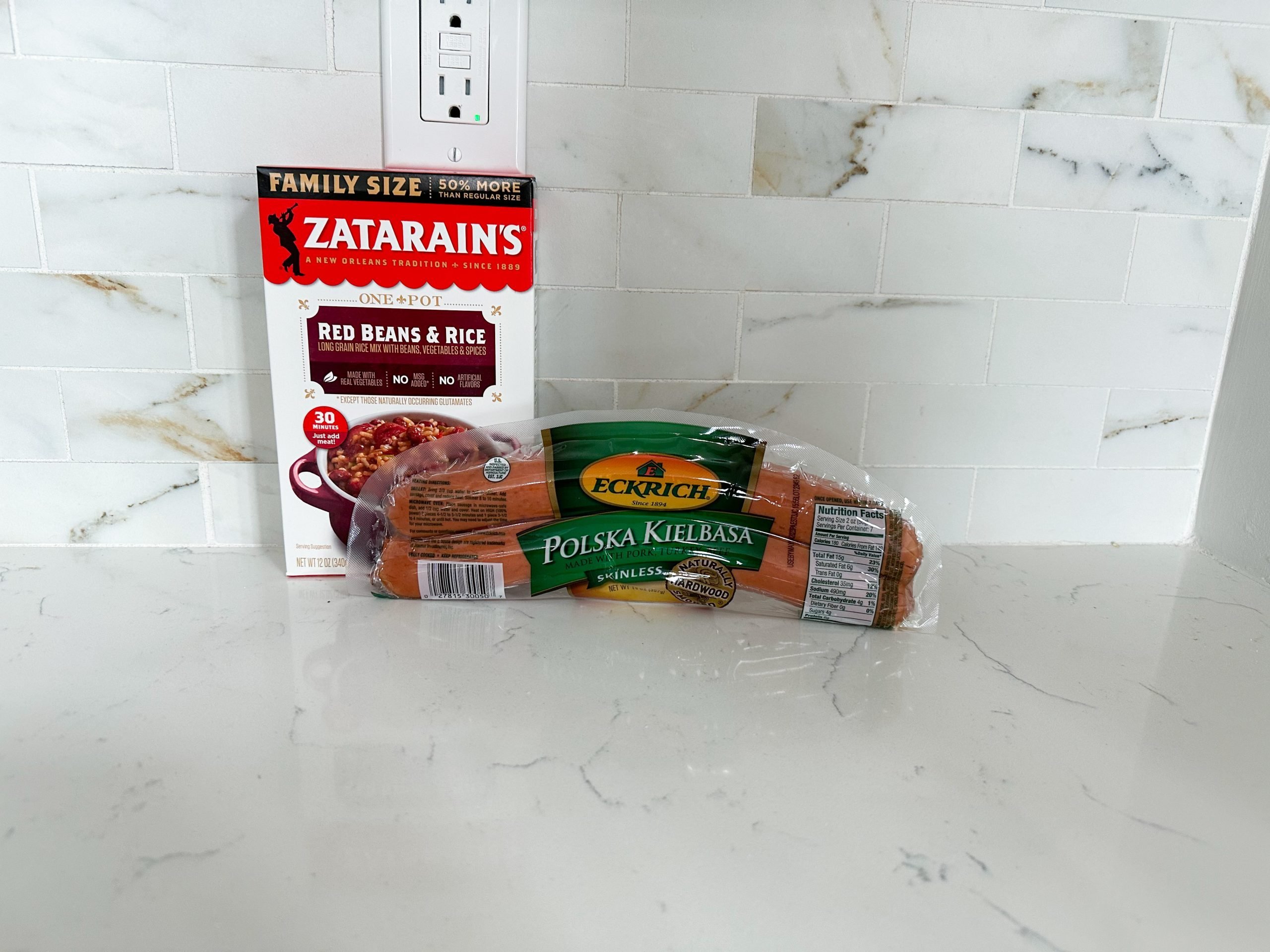 Ingredients for red beans and rice including sausage and rice mix