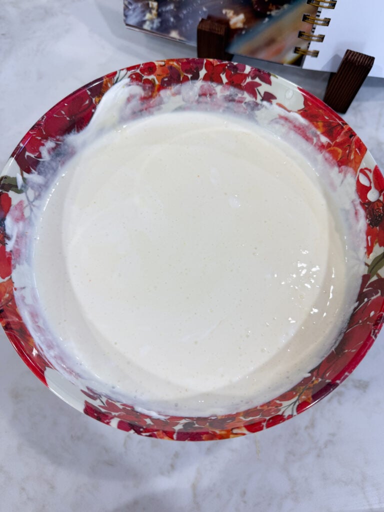 Pudding mix, milk, and whipped topping combined in a bowl