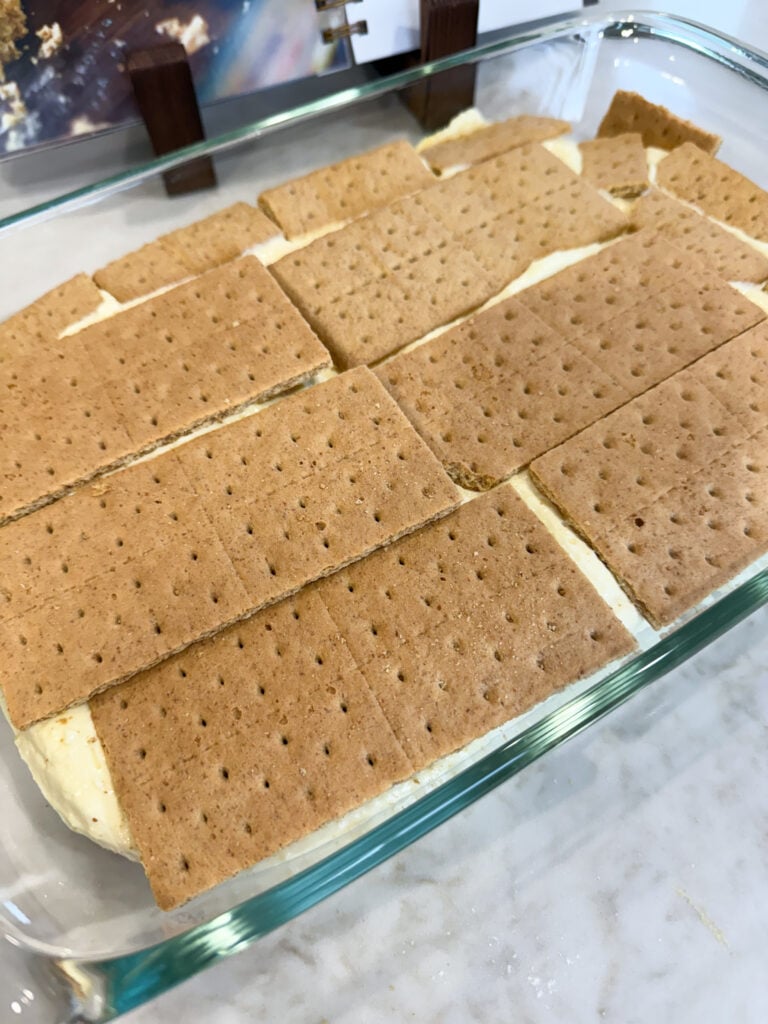 Graham crackers layered on top of filling