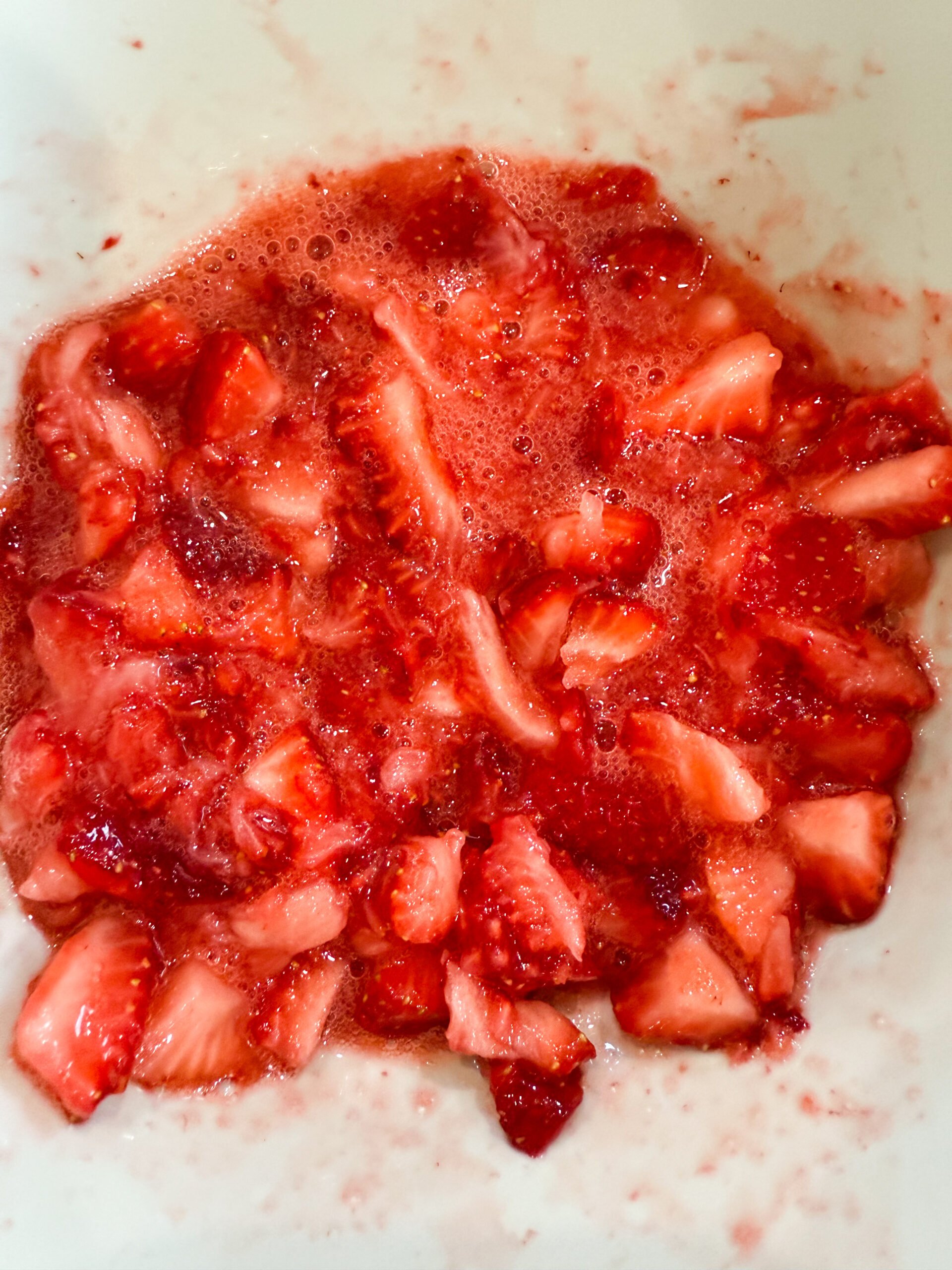 Stir mashed strawberries into the cheesecake mixture