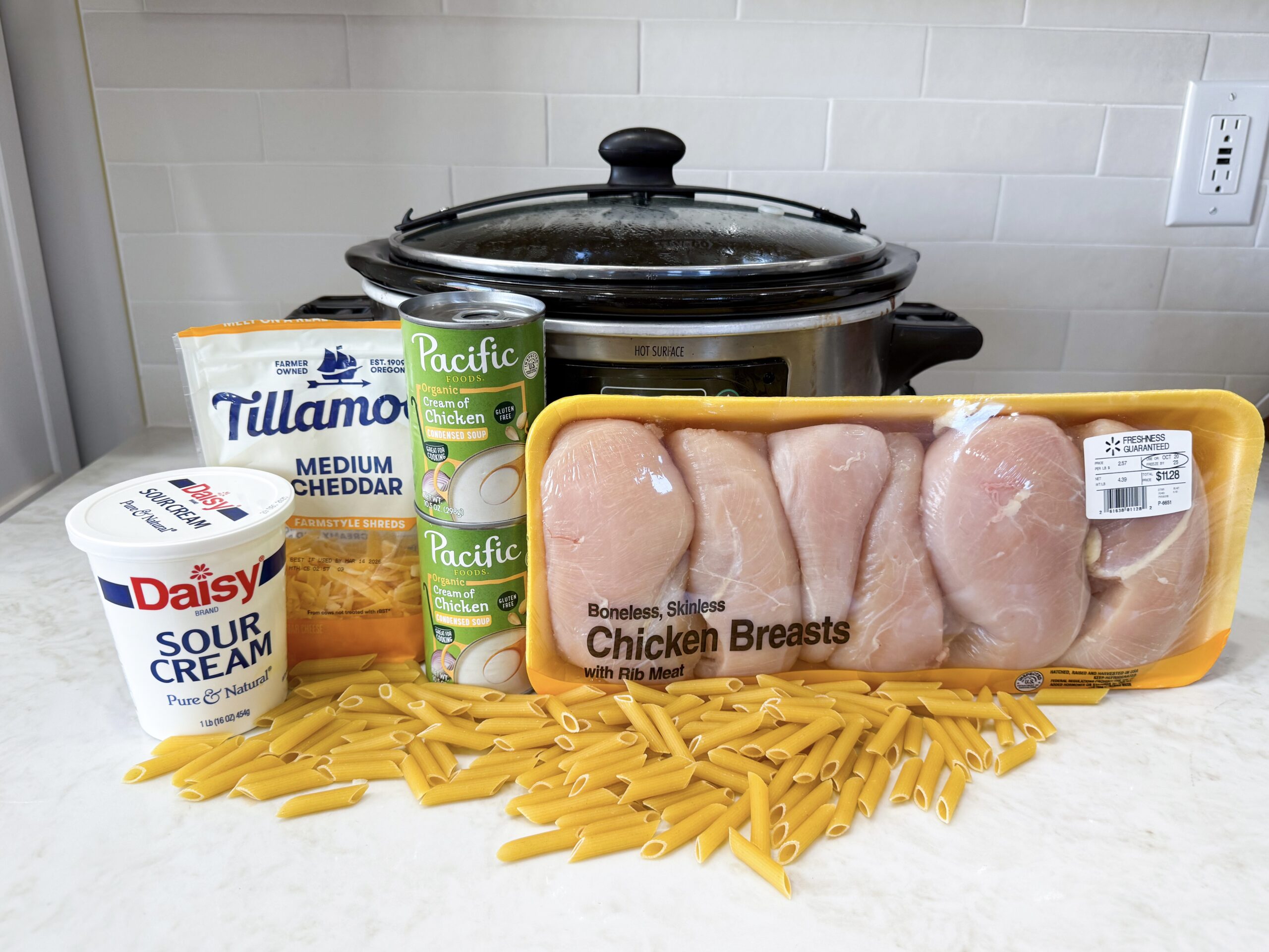 Ingredients for creamy Rotel chicken pasta on counter
