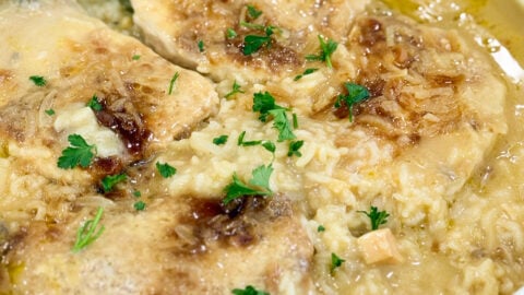 No Peek Pork Chop Casserole baked in dish with tender pork chops and creamy rice.