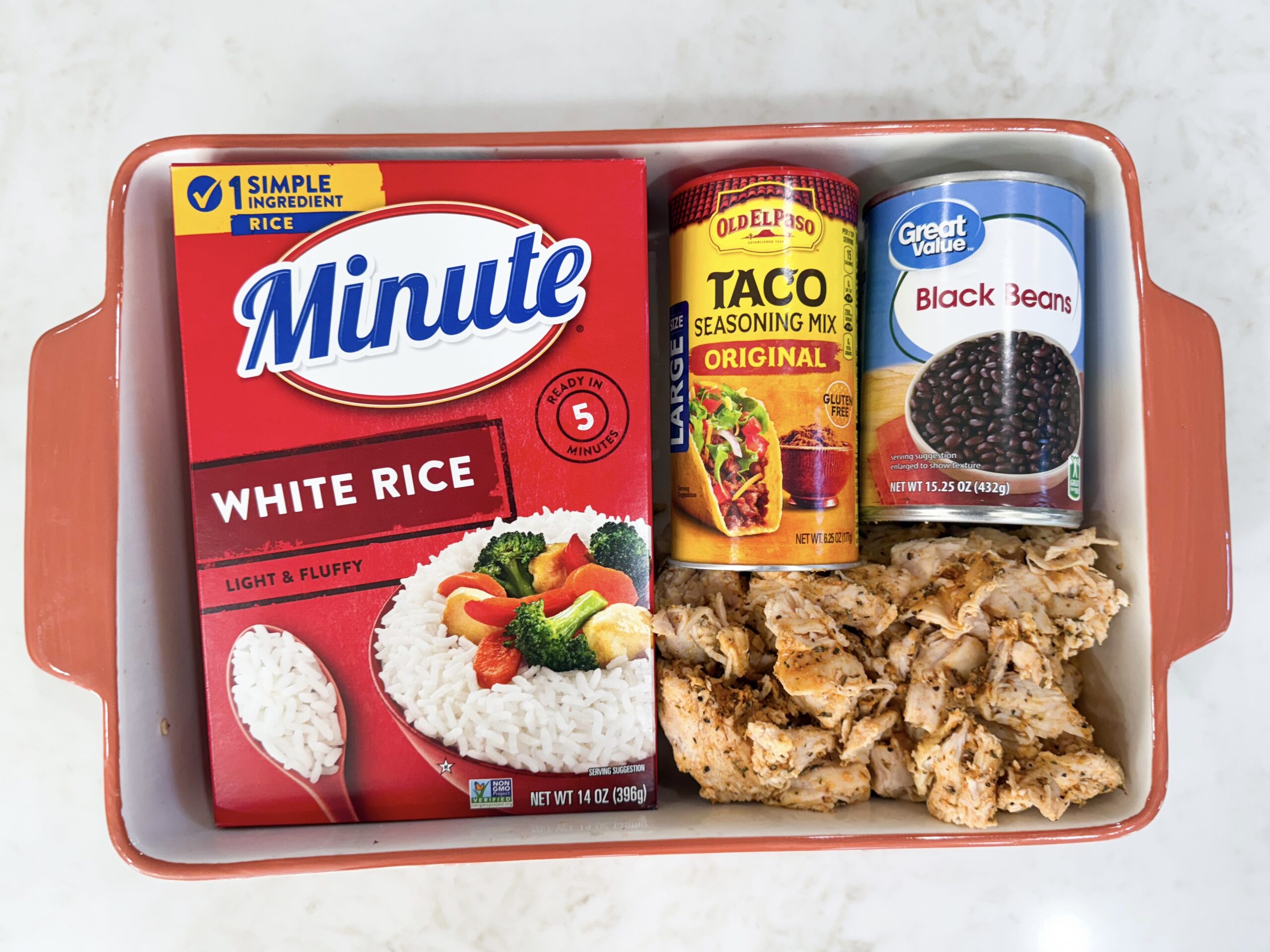 Ingredients for fiesta chicken casserole in casserole dish