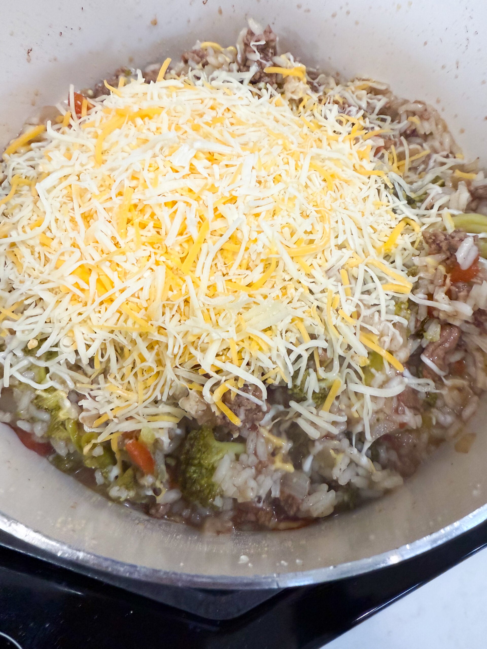 cheese added to beef and rice