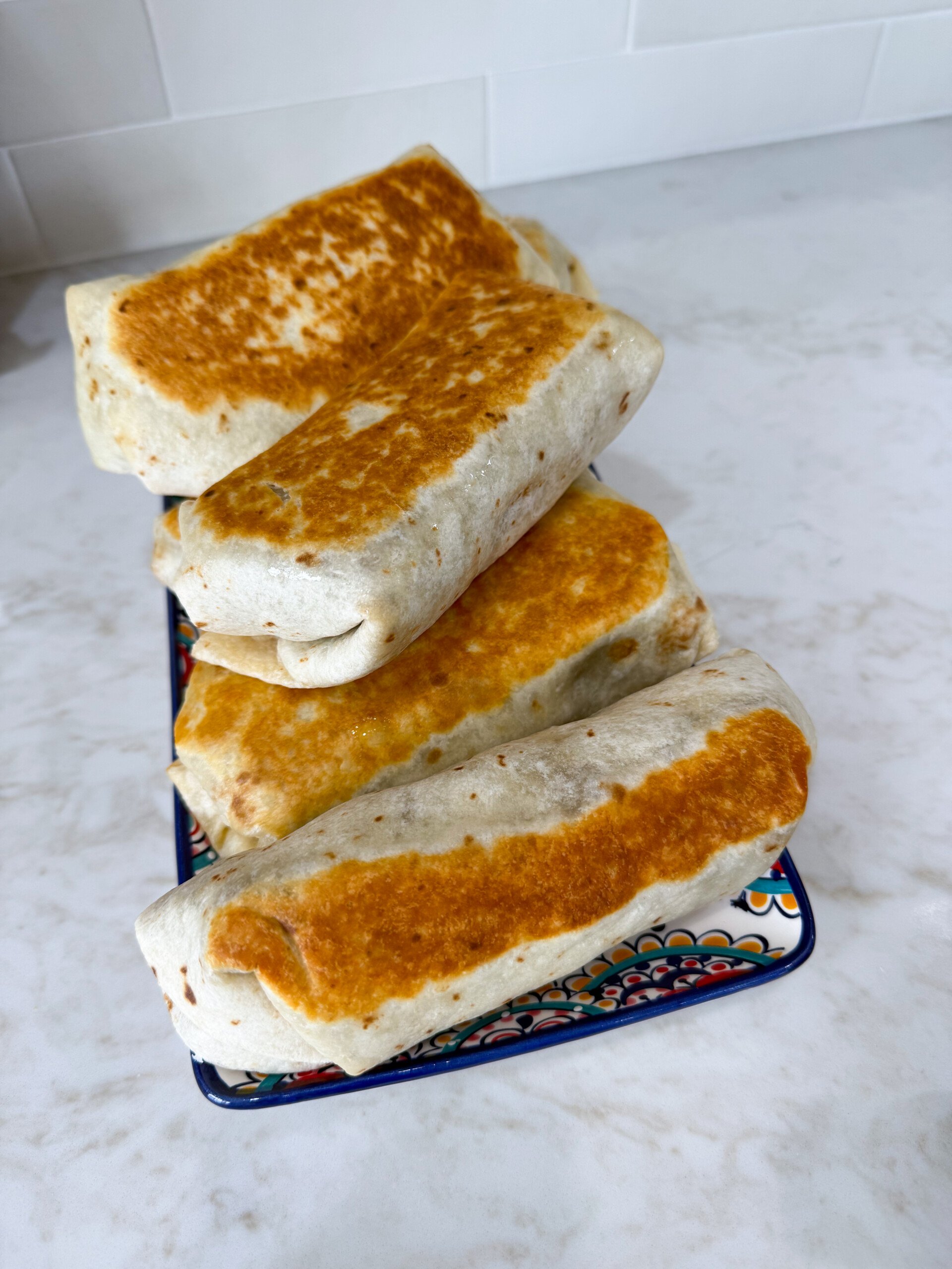 Lentil burritos on a plate.