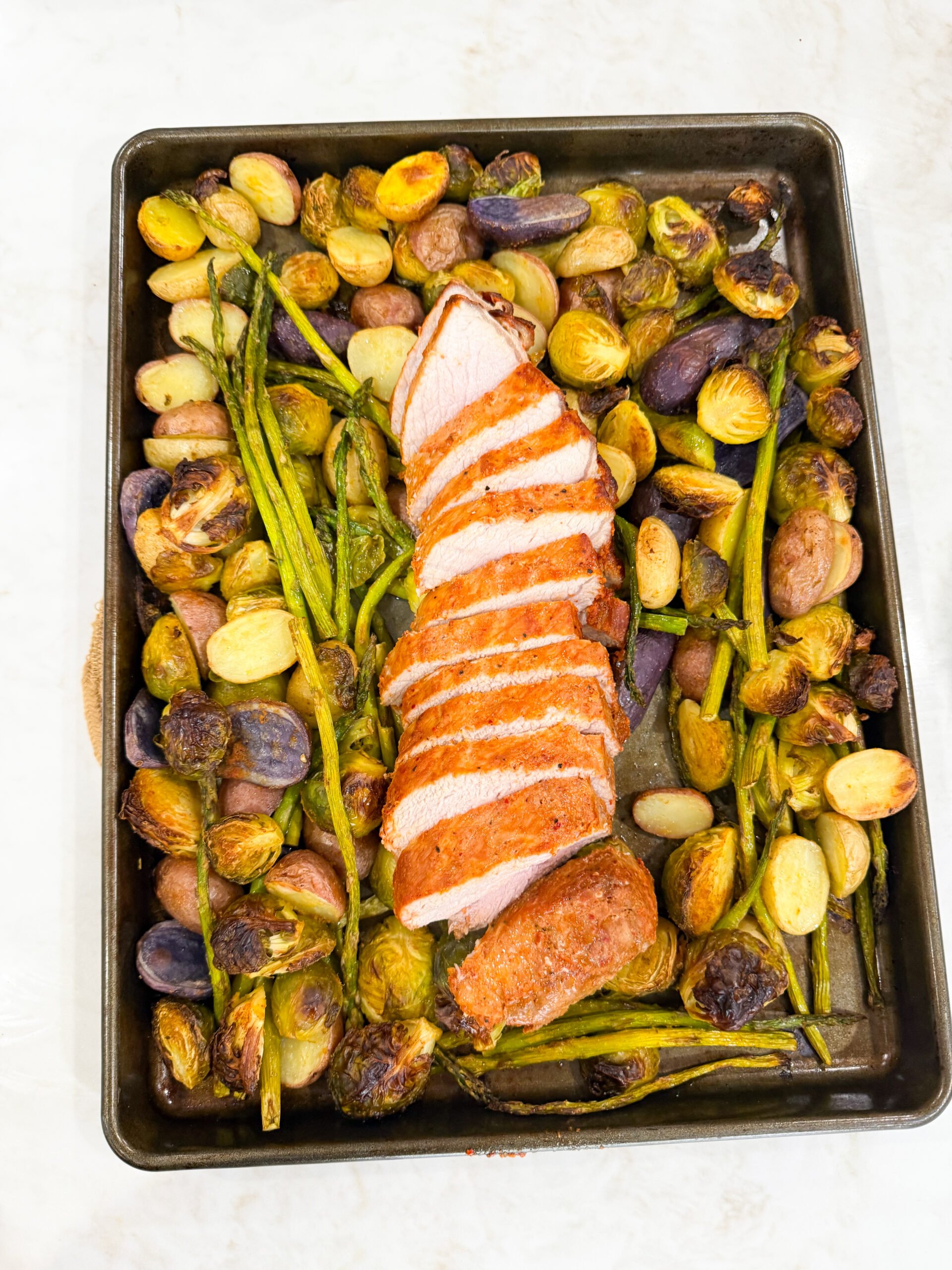 sliced pork tenderloin with roasted vegetables
