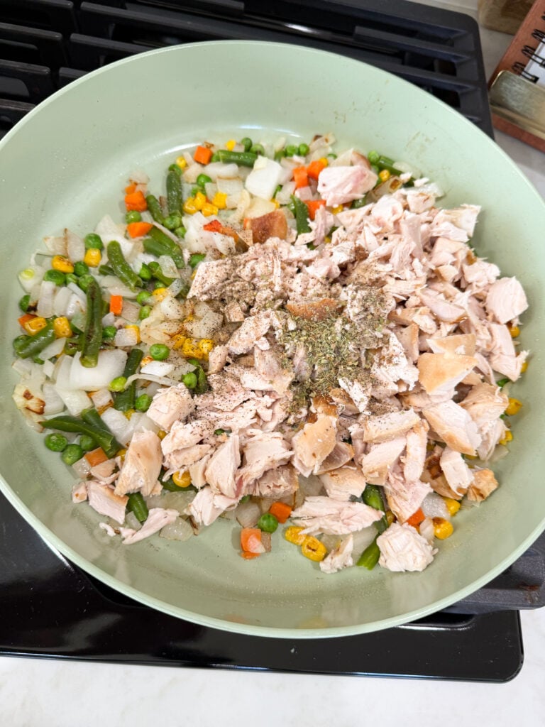 add dinner ingredients to skillet