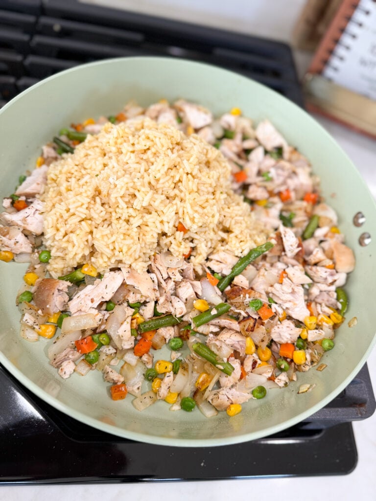 add rice to cooked chicken