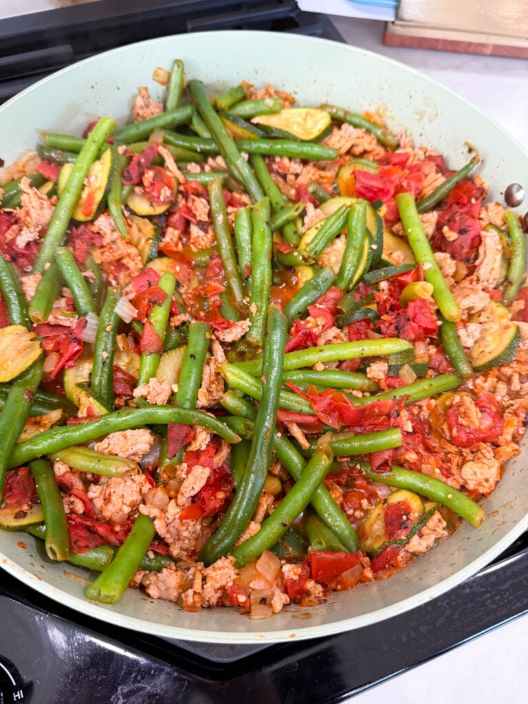 add tomatoes to the turkey and veggies