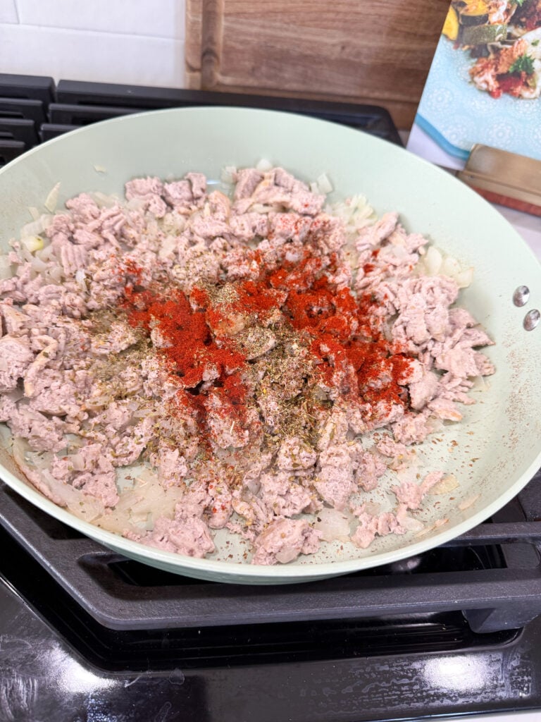 season ground turkey in pan