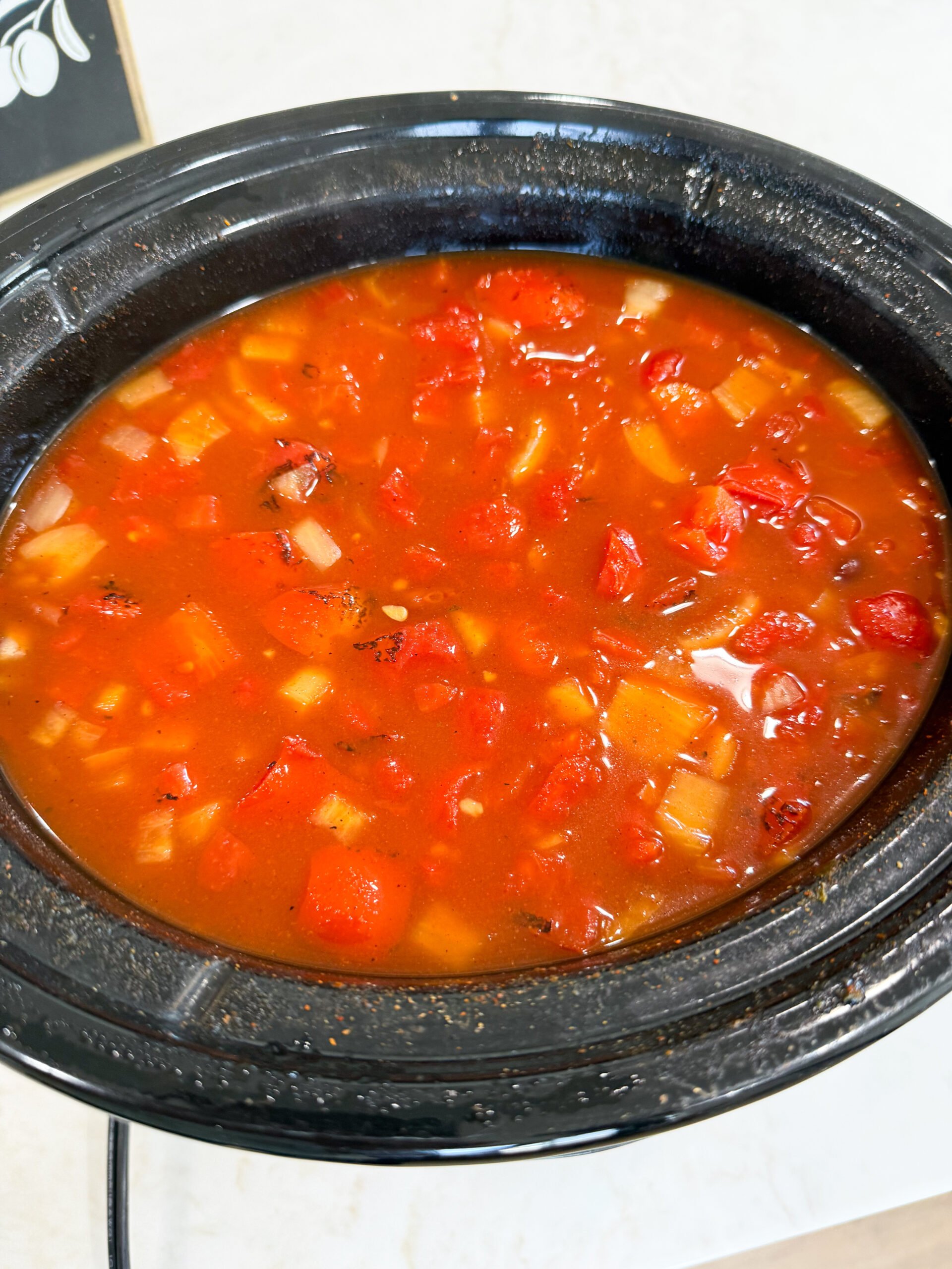chili ingredients mixed in slow cooker