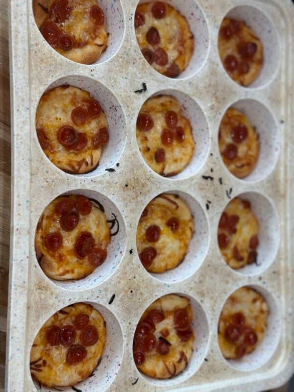 cooked easy pizza cups in silicane muffin baking sheet