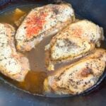 cooked seasoned chicken in a slow cooker