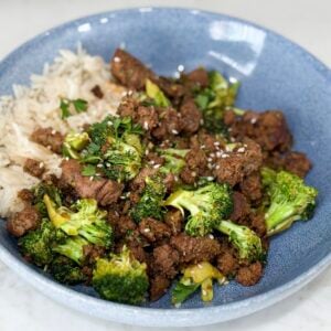 Cook Sweet & Spicy Turkey and Broccoli Bowl Recipe in a blue bowl on a white counter