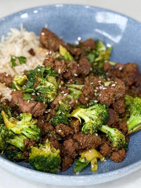 Cook Sweet & Spicy Turkey and Broccoli Bowl Recipe in a blue bowl on a white counter