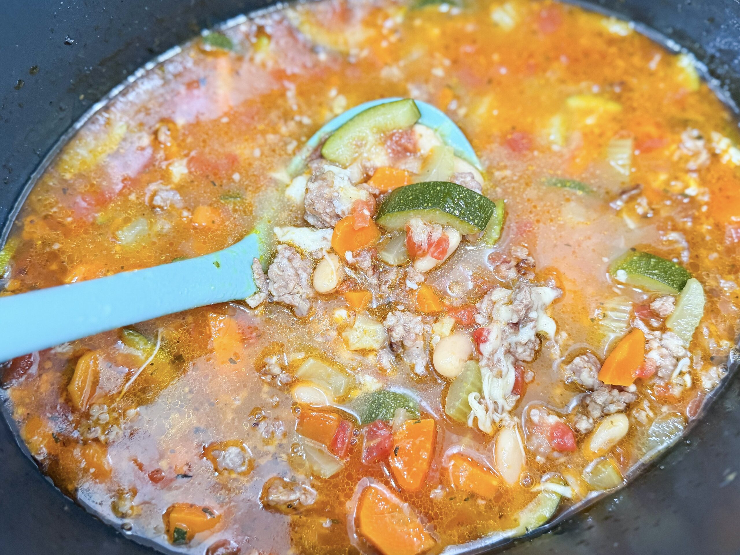 Finished Italian Vegetable and Sausage Soup simmering in crock