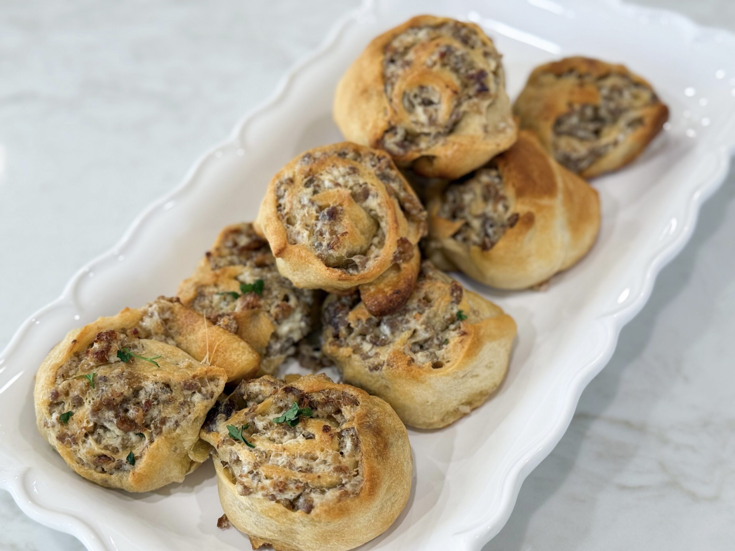 Golden sausage cream cheese pinwheels fresh from the oven.