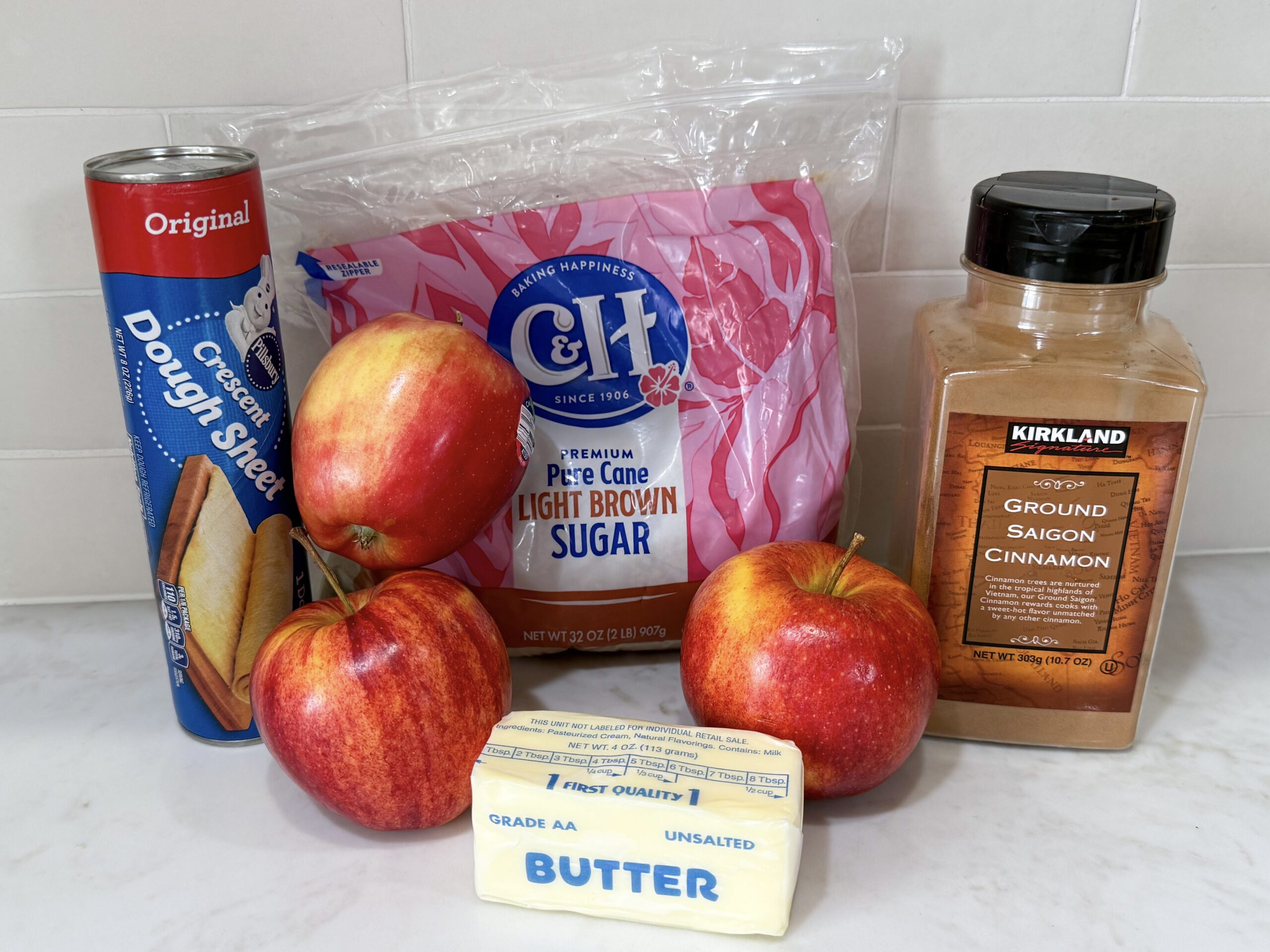 Ingredients for apple crescent donuts on counter