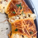 Golden baked crescent ring stuffed with chicken, bacon, and Alfredo sauce