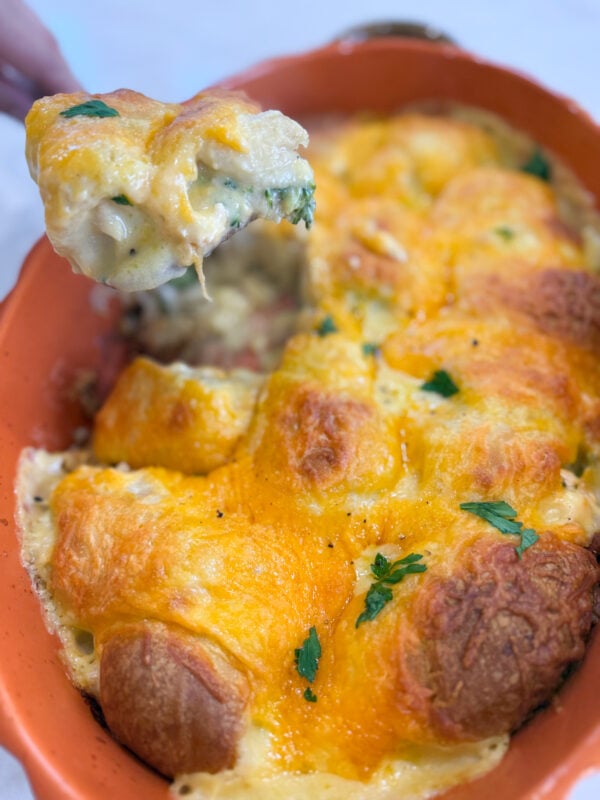Golden brown cheesy chicken crescent roll casserole baked in a pan