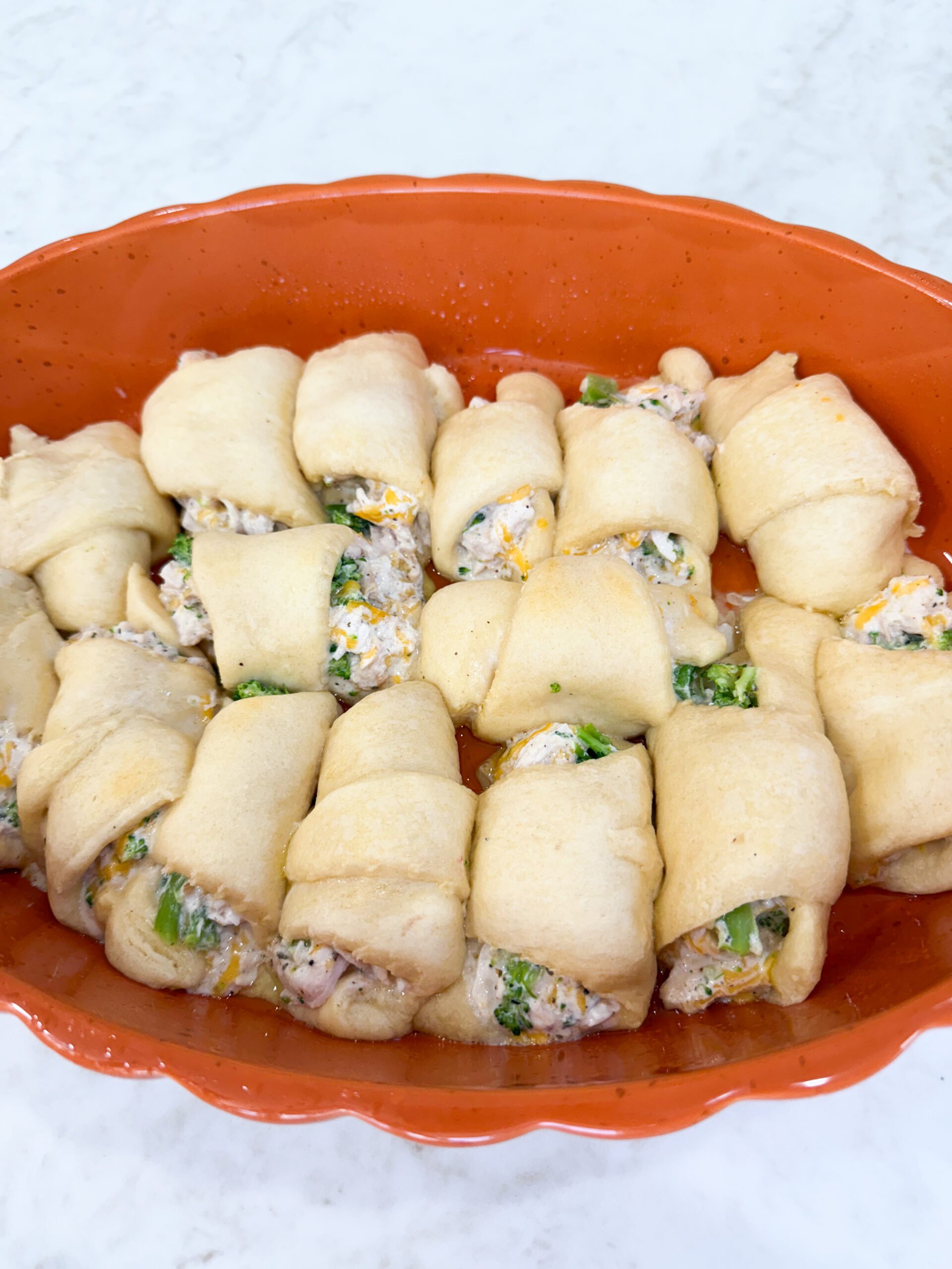 Chicken crescent rolls arranged in greased 9x13 pan