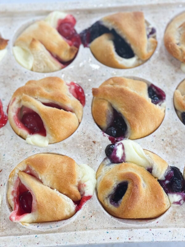 Golden mini cheesecake pies topped with blueberry filling