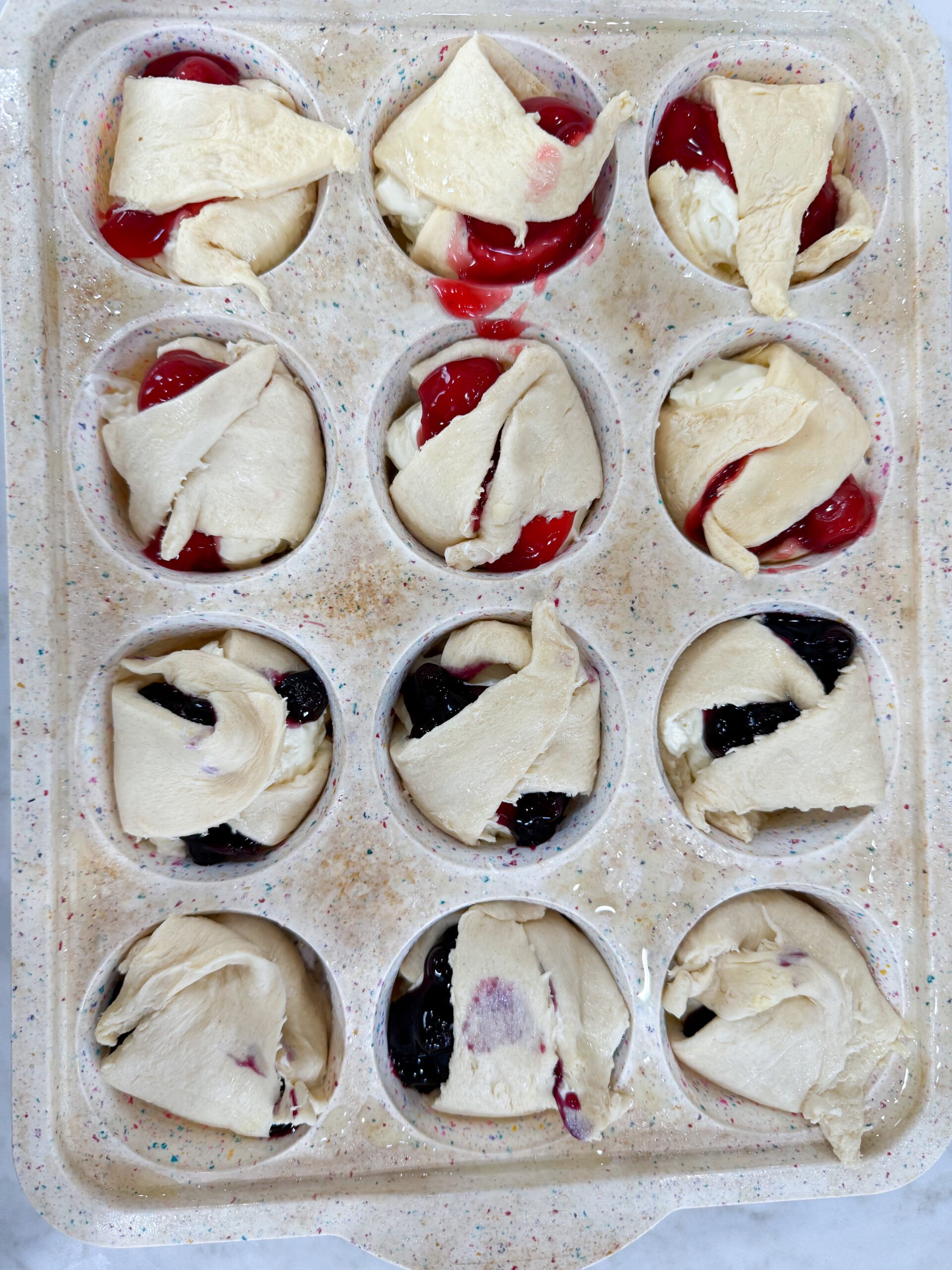 Dough folded over the top of the cheesecake pies