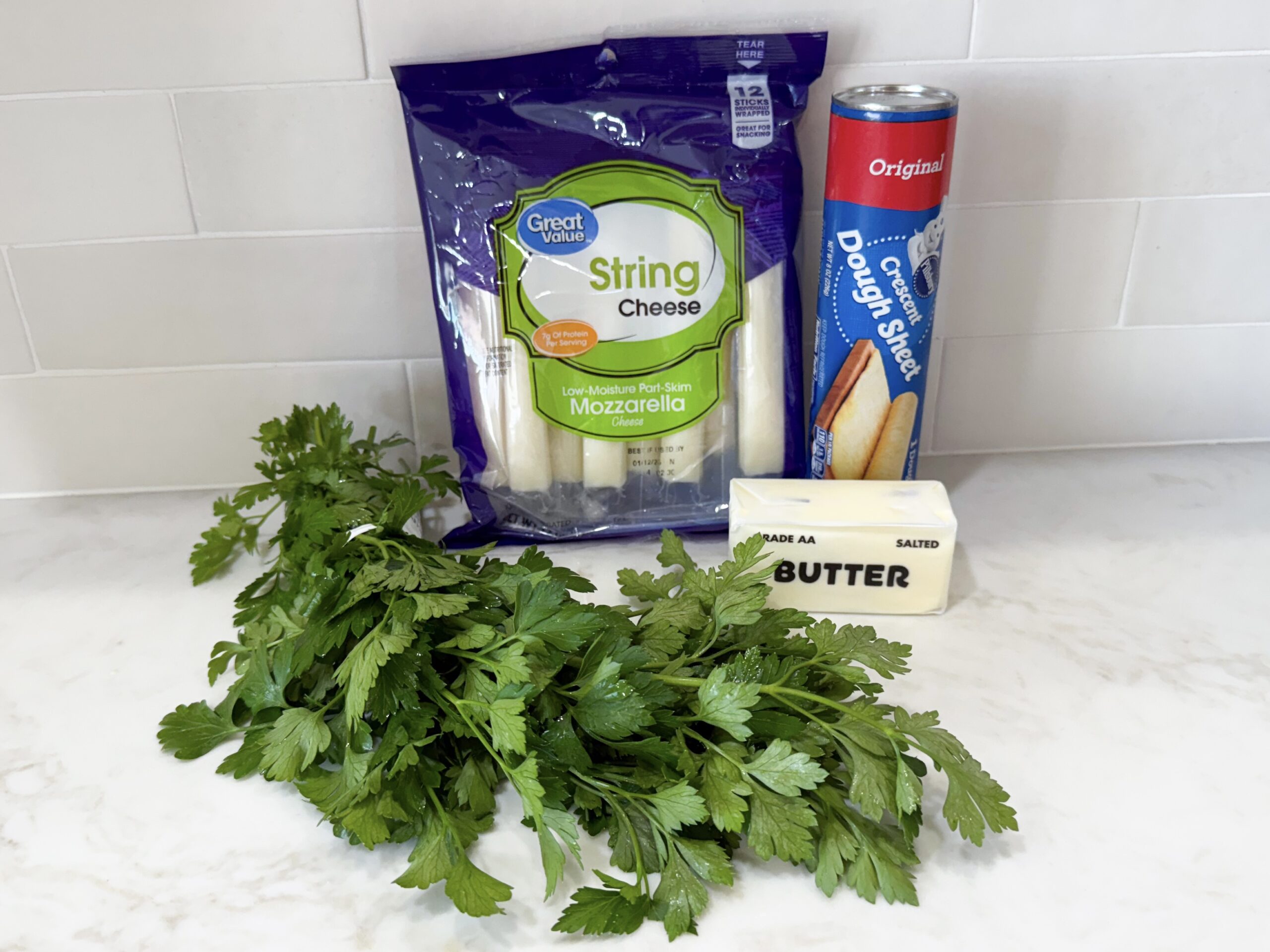 Ingredients for mozzarella-stuffed garlic breadsticks on counter