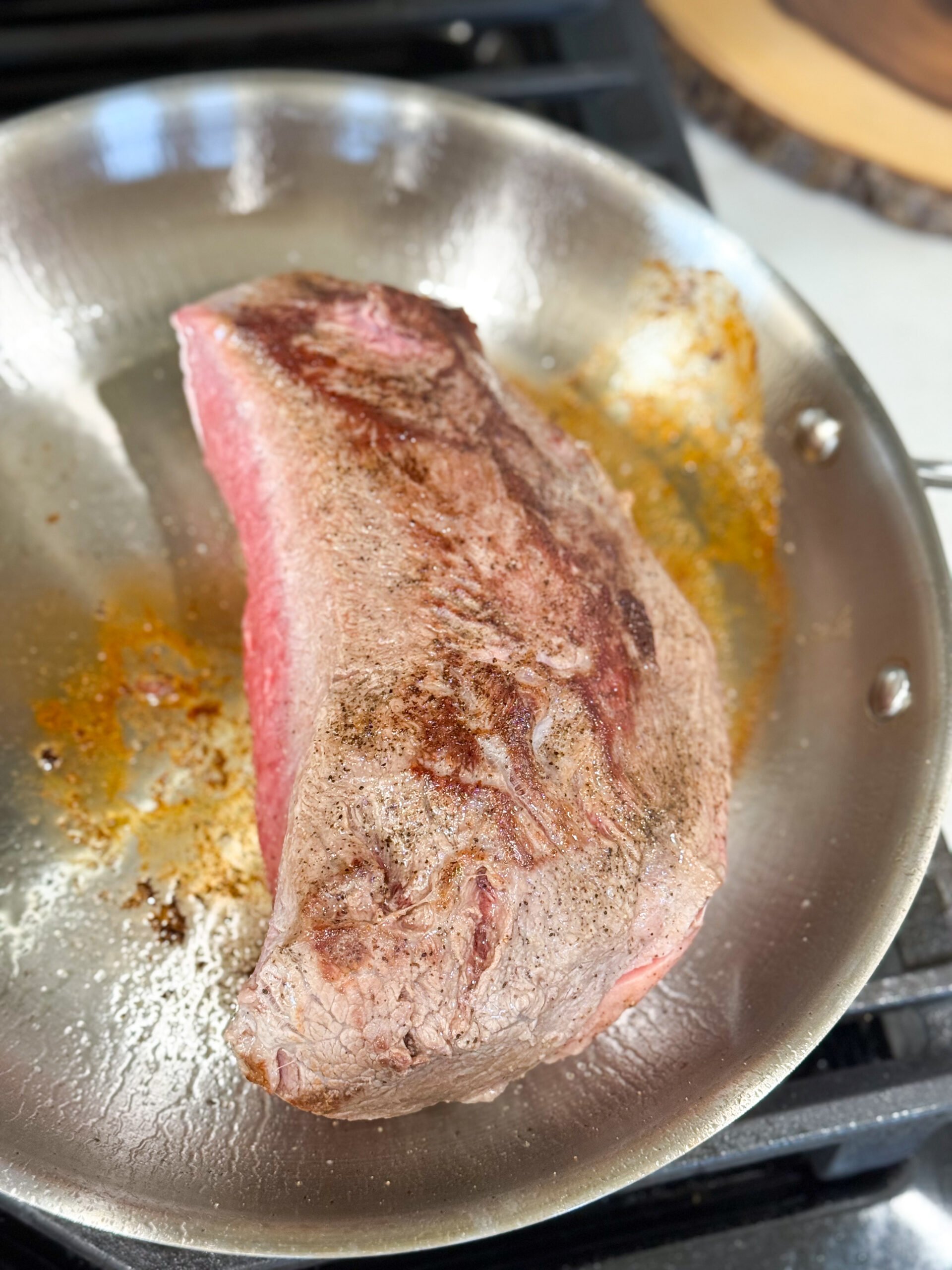 Searing beef roast in skillet for stroganoff