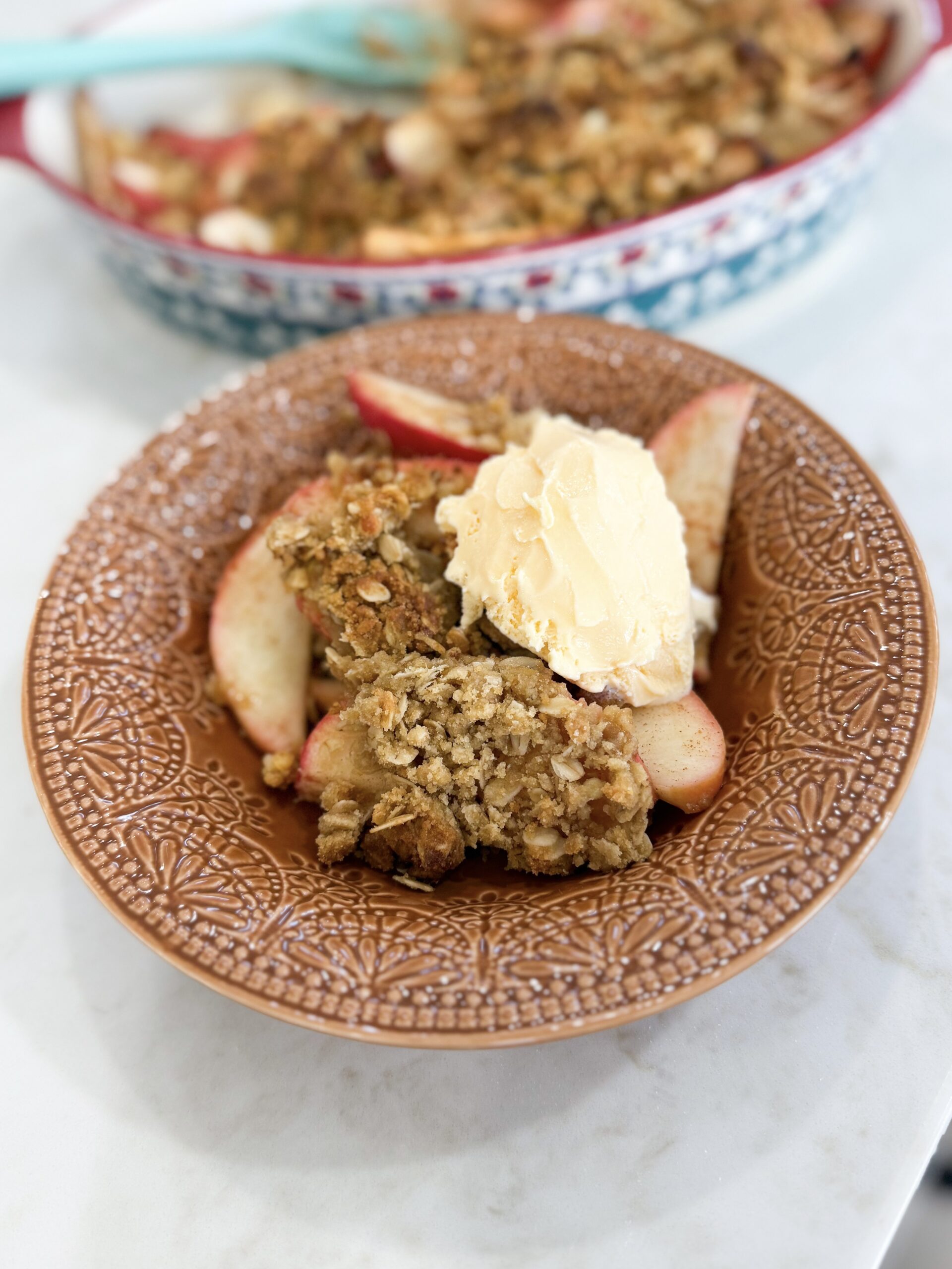 Warm apple crisp with golden oat topping