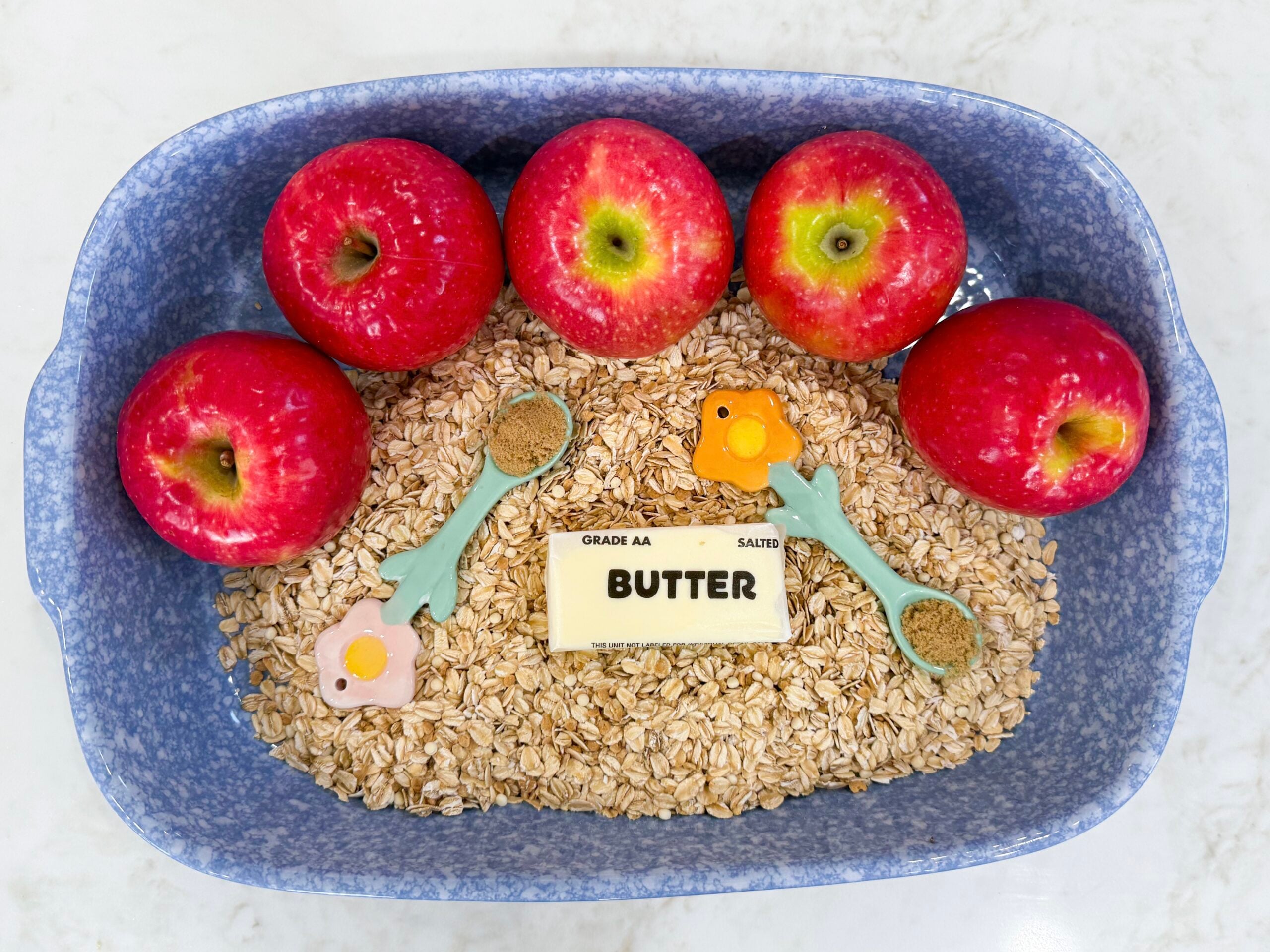 Ingredients for Grandma’s Old Fashioned Apple Crisp arranged in a pan