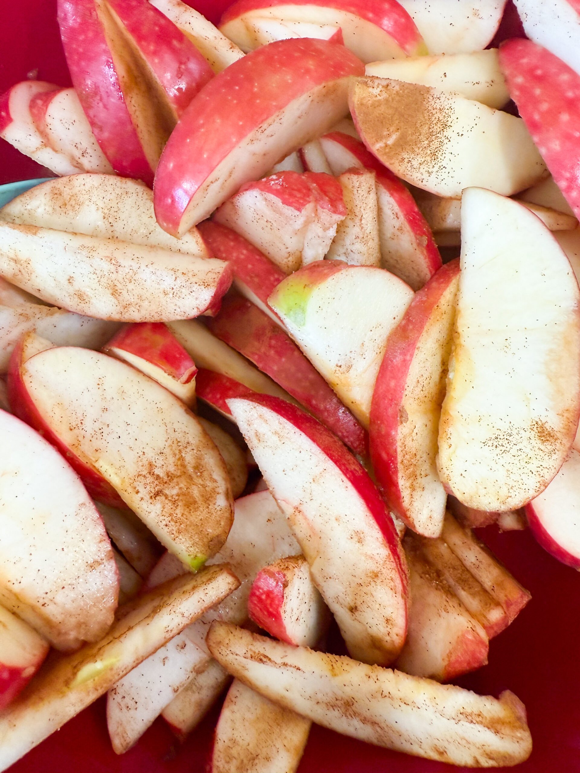 Apples tossed with sugar and cinnamon