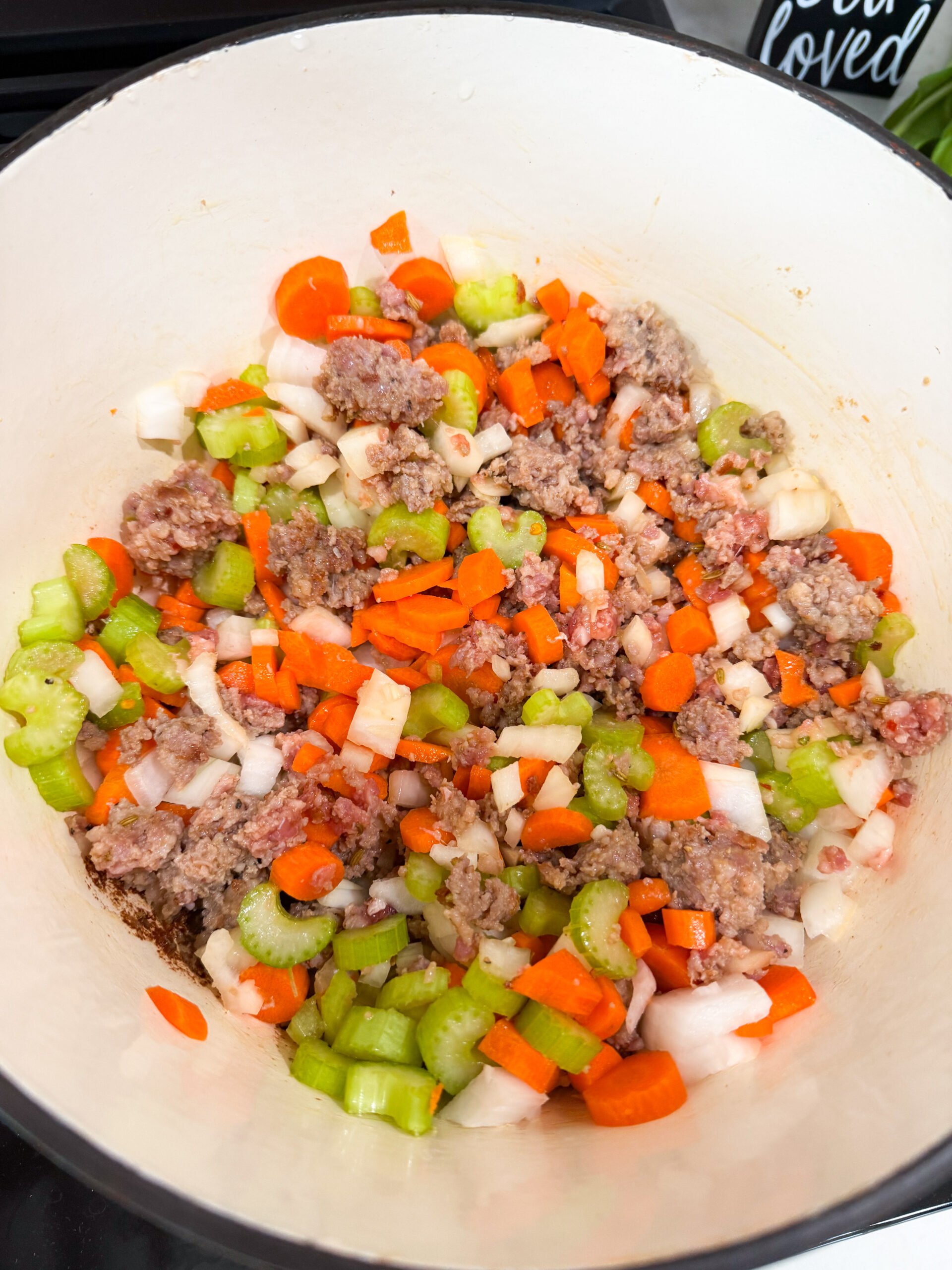 Carrots, onions, and celery added to the pot