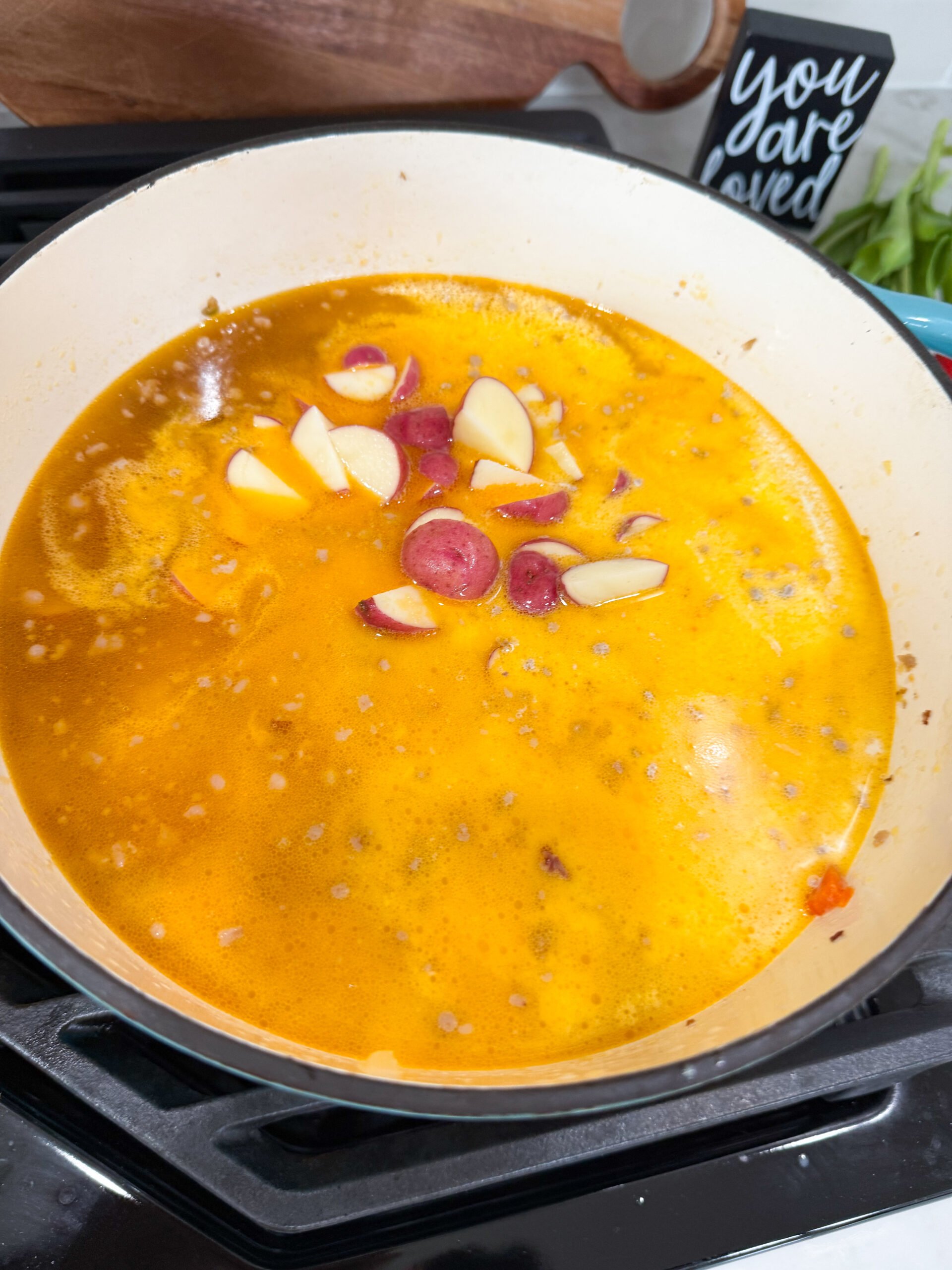 potatoes added to the soup pot